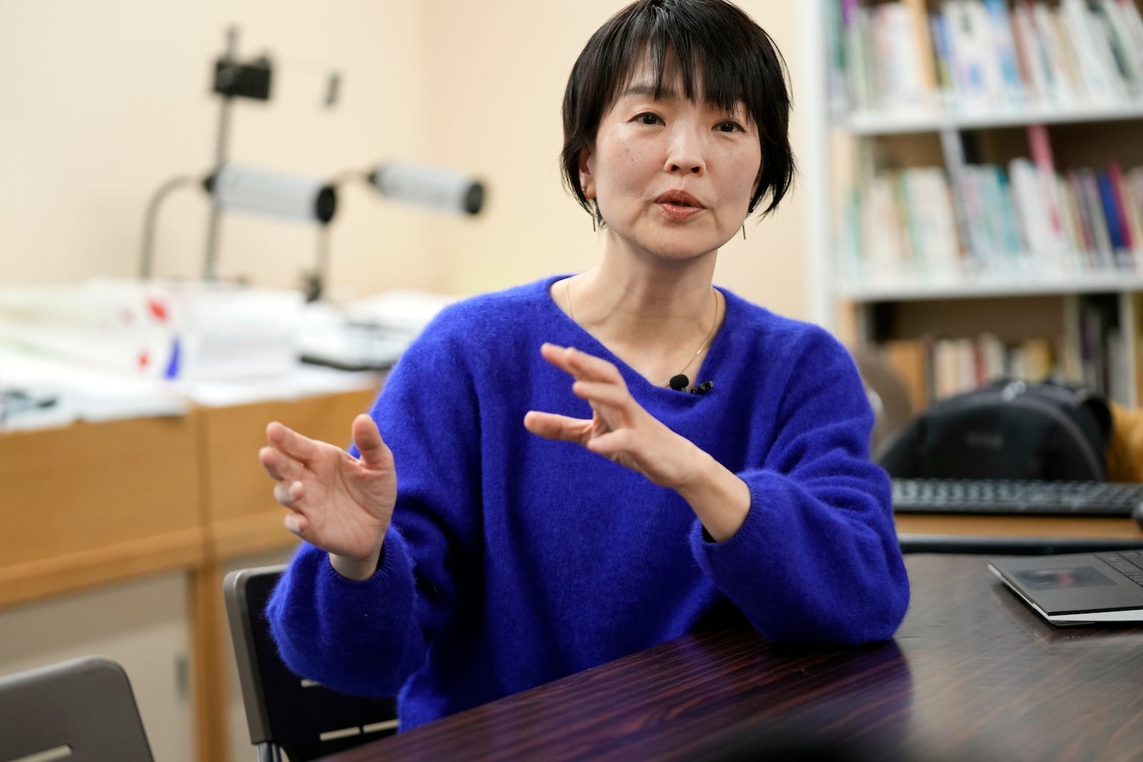 Ai Saotome, video archivist and daughter of Katsumoto Saotome, founding director of the Center of the Tokyo Raids and War Damage, speaks with The Associated Press on Feb. 24, 2025, in Tokyo. (AP Photo/Eugene Hoshiko)