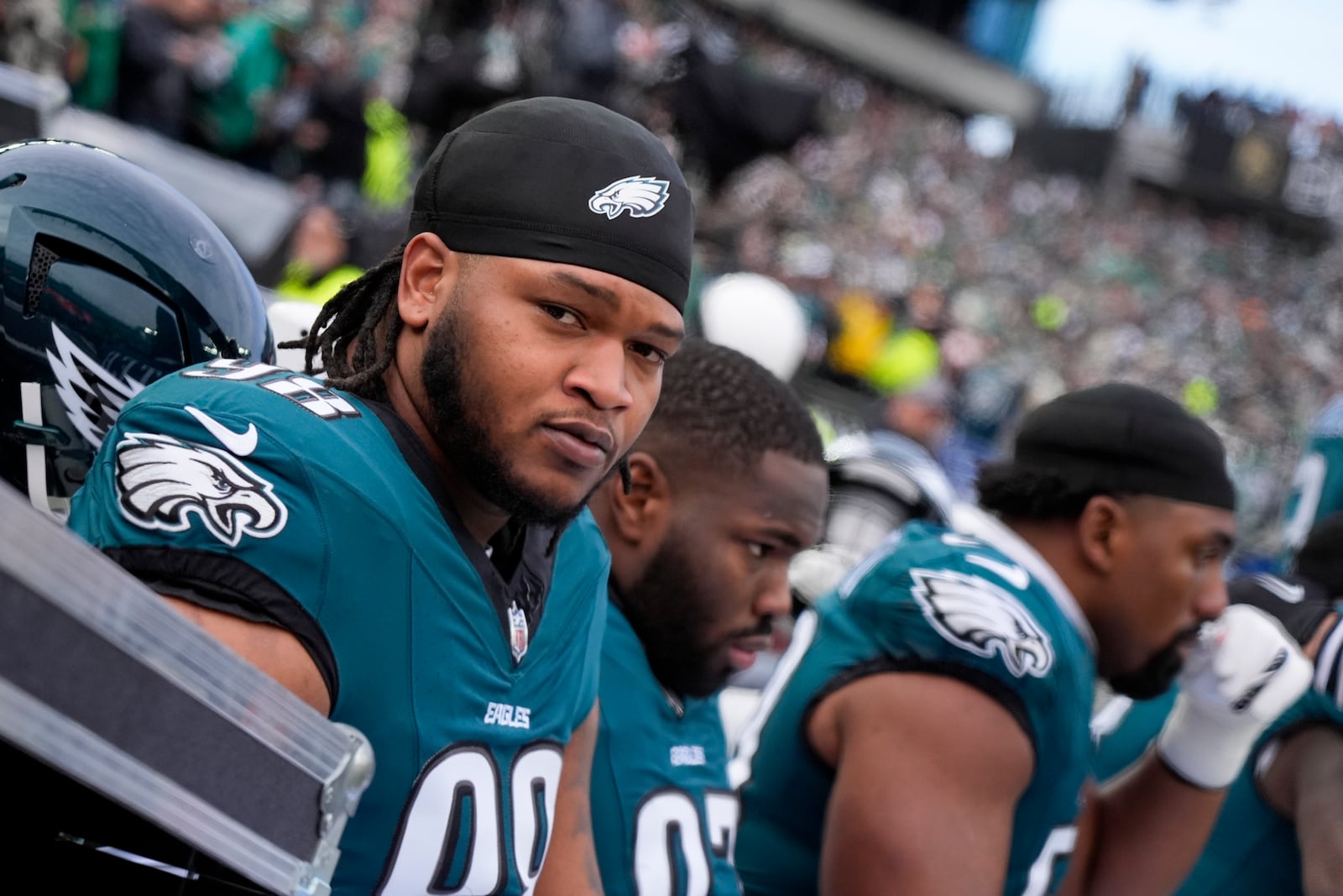 Philadelphia Eagles defensive tackle Jalen Carter wait for the start of the NFC Championship NFL football game between the Philadelphia Eagles and the Washington Commanders, Sunday, Jan. 26, 2025, in Philadelphia. (AP Photo/Chris Szagola)