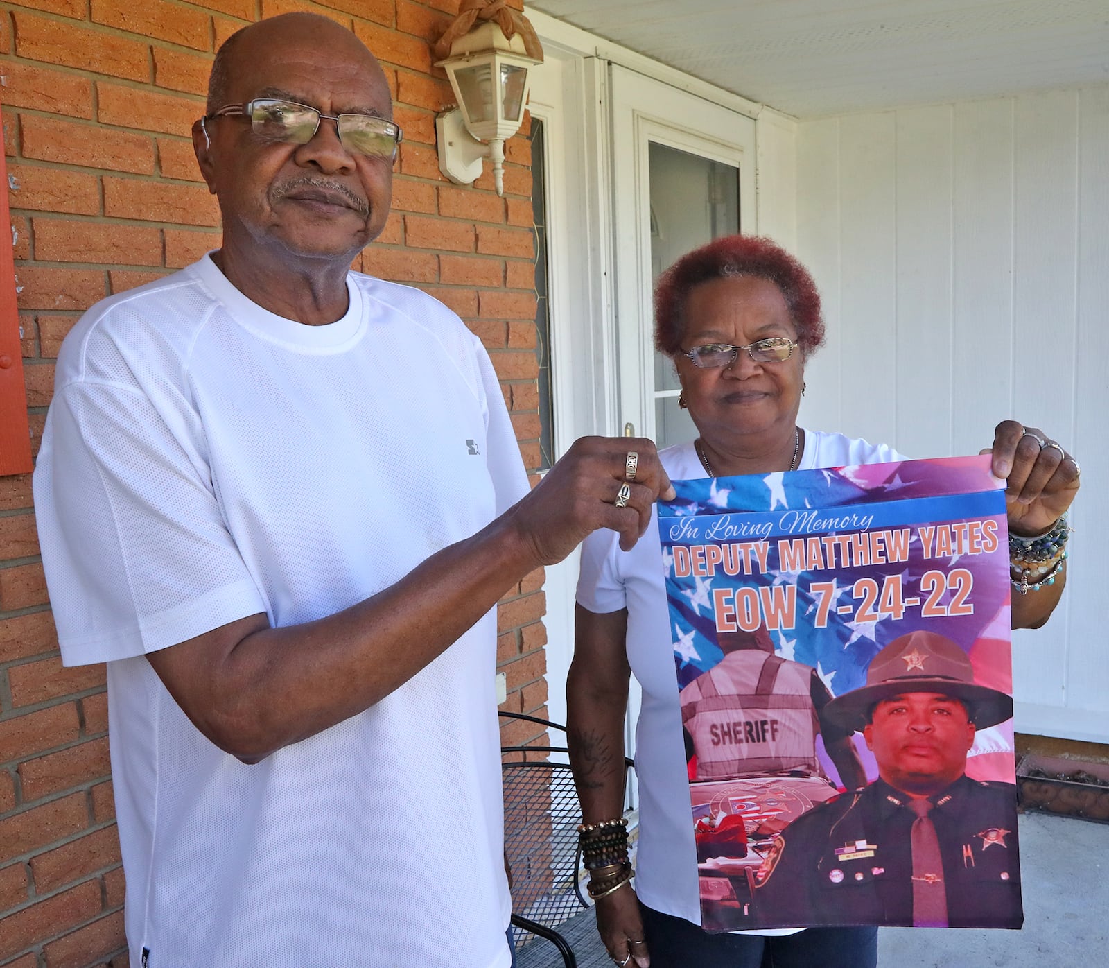 Lisa Yates, the mother of fallen Clark County Sheriff's Deputy Matthew Yates and Otis Williams, his uncle, with some of the momentoes of Matt Tuesday 20, 2022. BILL LACKEY/STAFF