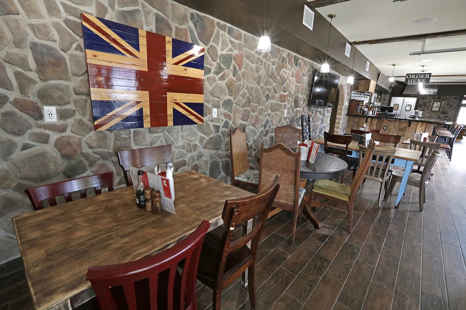 From the food to the decor and even the smell of fish-n-chips cooking, The Last Queen gastropub in Enon transports customers across the sea to a British pub. BILL LACKEY/STAFF BILL LACKEY/STAFF