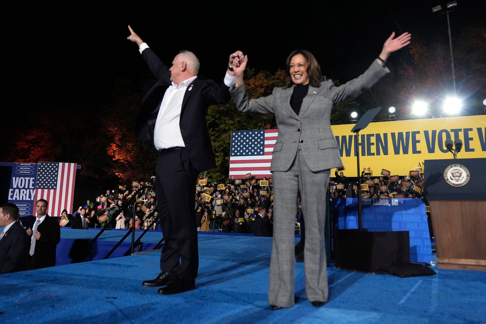 Democratic presidential nominee Vice President Kamala Harris, right, and her running mate Minnesota Gov. Tim Walz depart after speaking during a campaign rally at Burns Park in Ann Arbor, Mich., Monday, Oct. 28, 2024. (AP Photo/Paul Sancya)