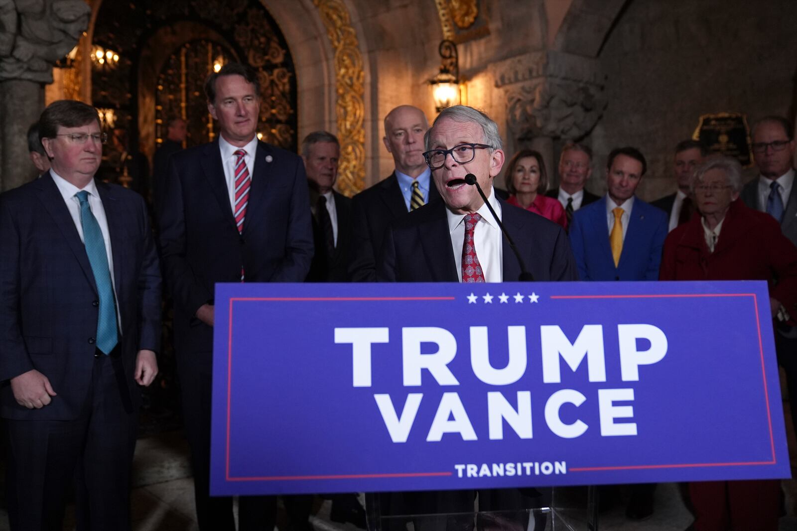 Ohio Gov. Mike DeWine speaks before President-elect Donald Trump during a meeting with Republican governors at Mar-a-Lago, Thursday, Jan. 9, 2025, in Palm Beach, Fla. (AP Photo/Evan Vucci)