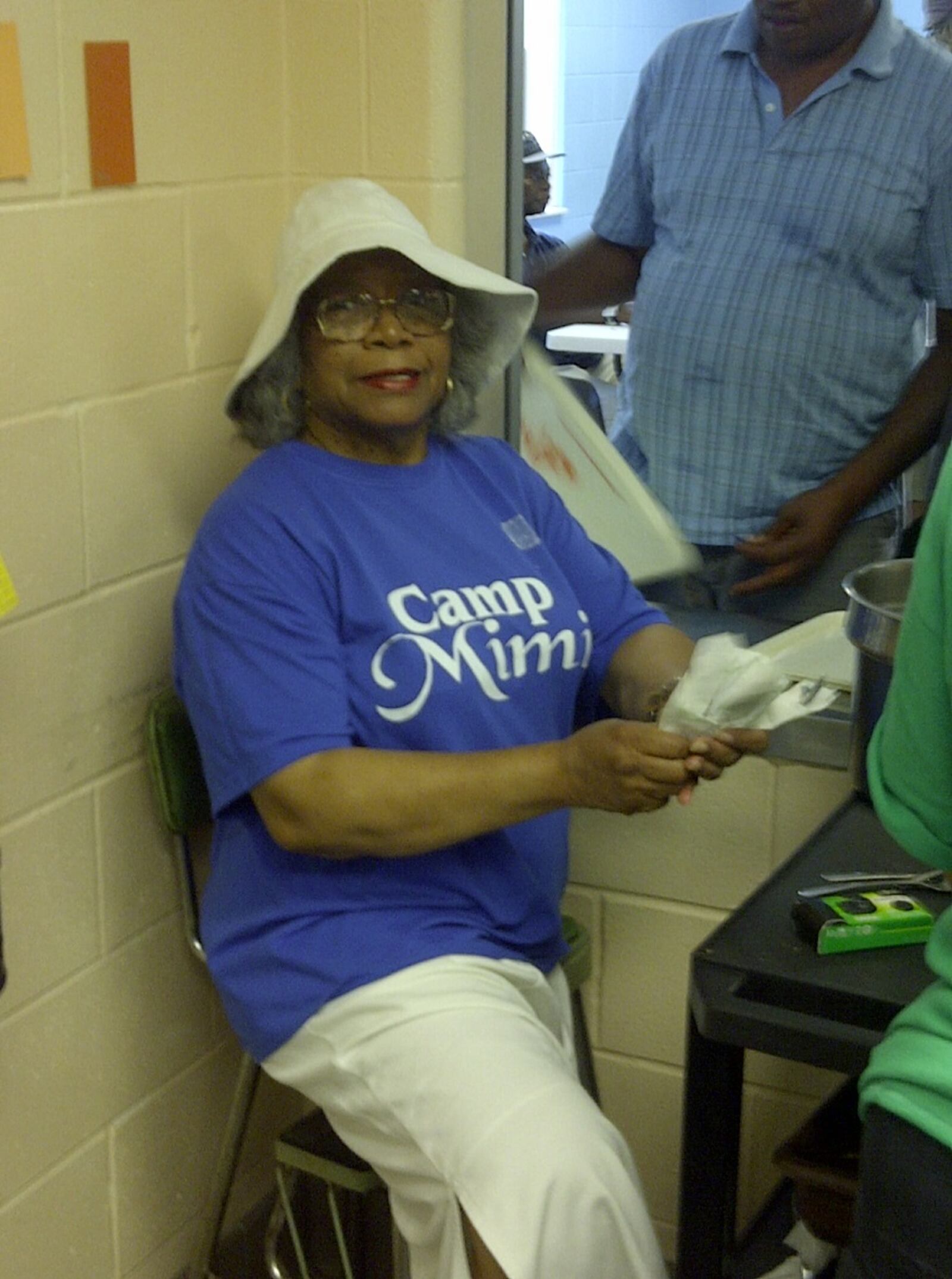 Terrelia Ogletree, aka Mimi, volunteers at the House of Bread where her family of young campers learned about volunteering. CONTRIBUTED