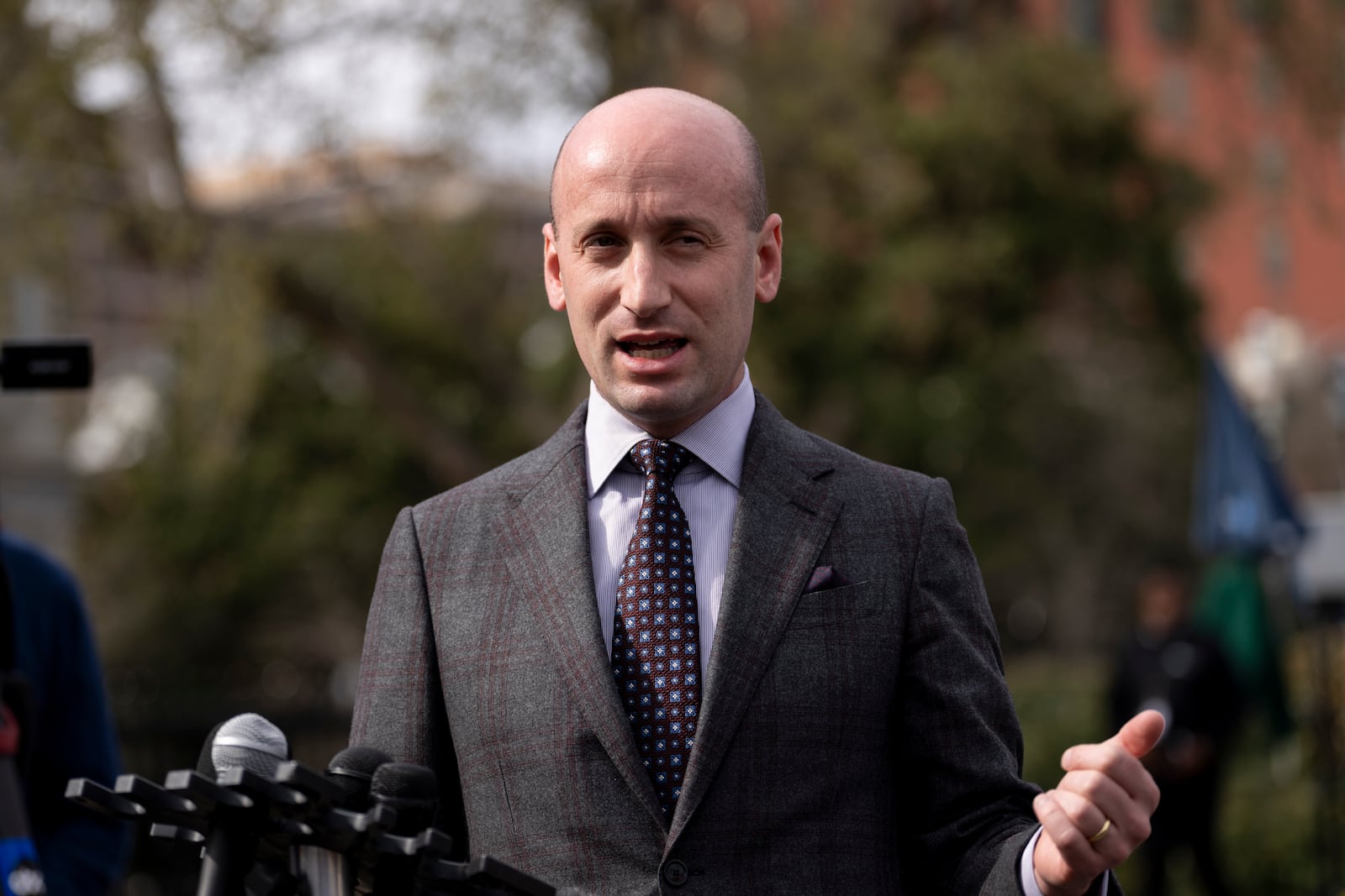 Deputy White House chief of staff Stephen Miller speaks to reporters at the White House in Washington, Wednesday, March 19, 2025. (AP Photo/Ben Curtis)