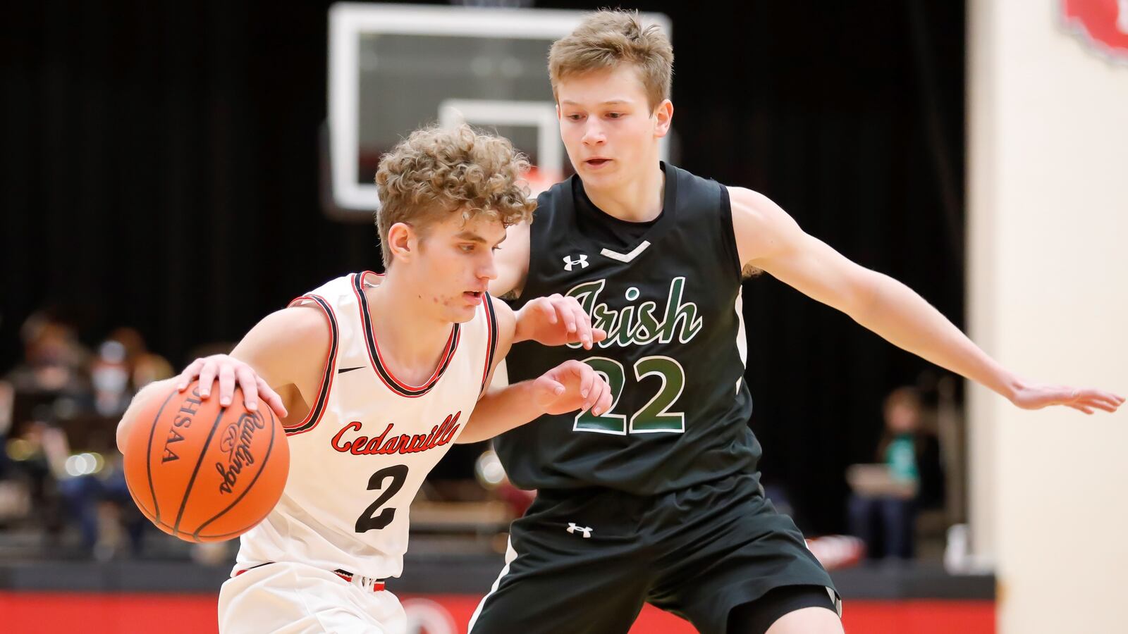 Cedarville High School senior Trent Koning is guarded by Catholic Central junior Ian Galluch during their game on Tuesday night in Cedarville. Koning had 19 points as the Indians won 44-37. Michael Cooper/CONTRIBUTED