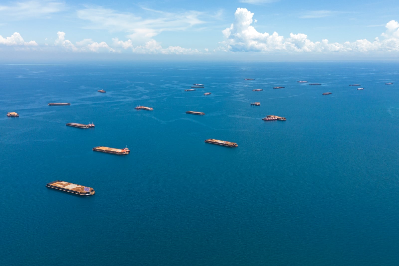 Barges loaded with nickel ore are anchored off Kabaena Island in South Sulawesi, Indonesia, Saturday, Nov. 16, 2024. (AP Photo/Yusuf Wahil)