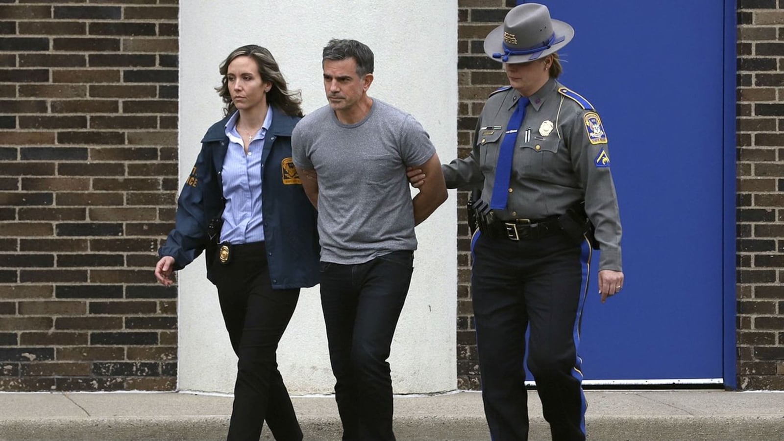 Fotis Dulos, pictured being escorted Tuesday, Jan. 7, 2020, from the Connecticut State Police barracks in Bridgeport, has been charged with murder, felony murder and kidnapping in the disappearance and presumed death of his estranged wife, Jennifer Dulos, 50, of New Canaan, Conn. Jennifer Dulos was last seen alive May 24, 2019, as she dropped the couple’s children off at school. Her body has not been found. (AP Photo/Chris Ehrmann)