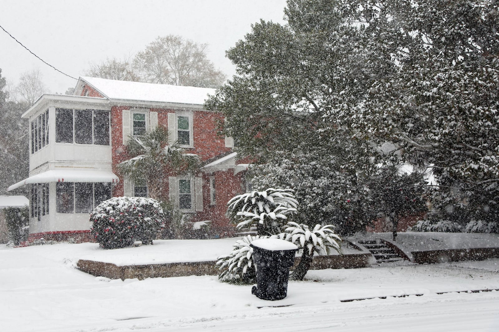 Homes covered in snow in a neighborhood where up to six inches have accumulated on Tuesday, Jan. 21, 2025, in Pensacola, Fla. (Luis Santana/Tampa Bay Times via AP)