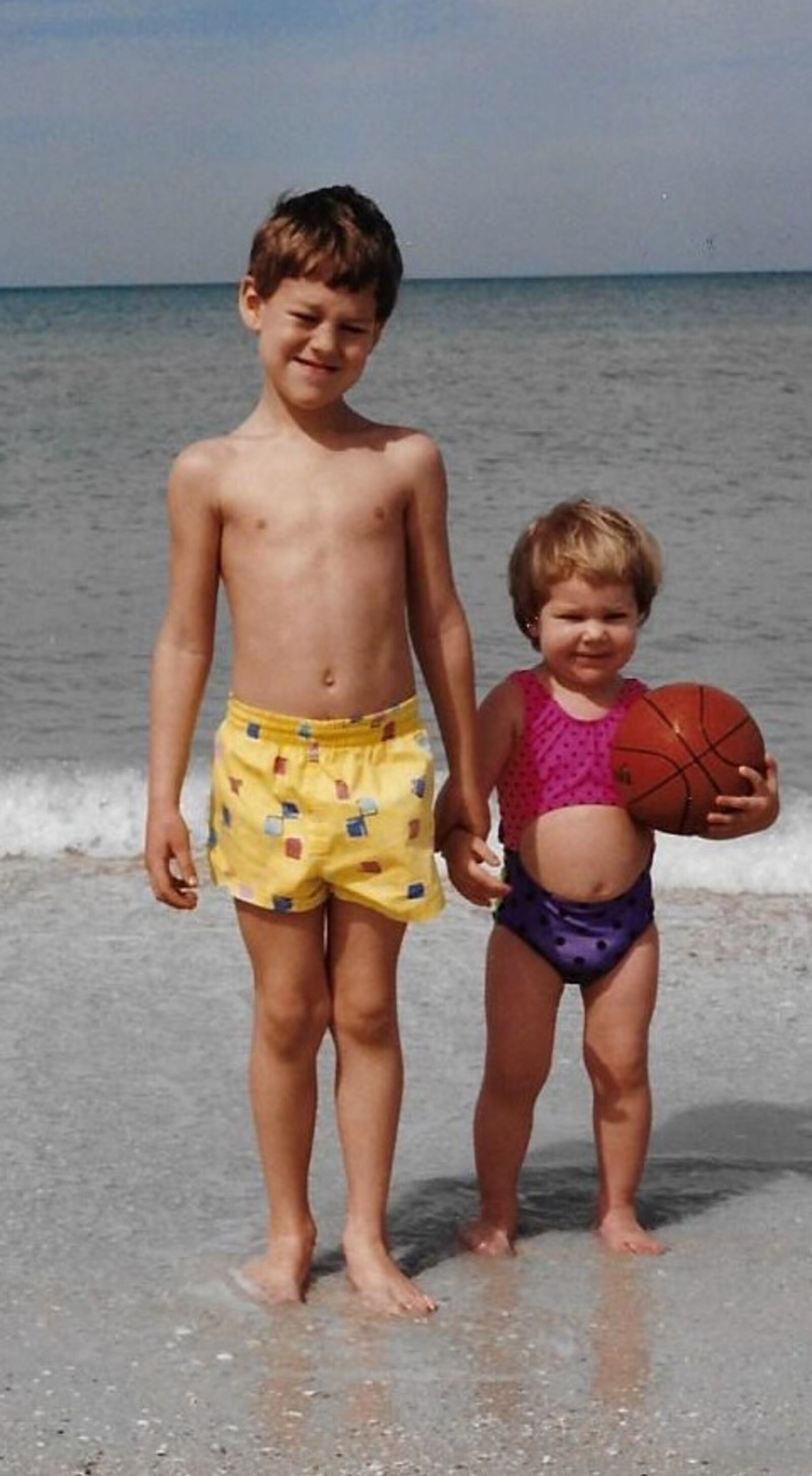 Sarah Schulz was already toting around a basketball when she was just 2. Here she is at the beach with her older brother, James, who was 5. CONTRIBUTED