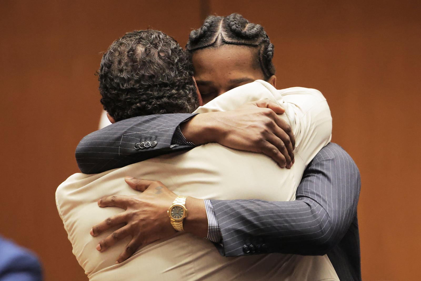 A$AP Rocky hugs attorney Joe Tacopina after he was found not guilty during his trial Tuesday, Feb. 18, 2025, in Los Angeles. (Daniel Cole/Pool Photo via AP)