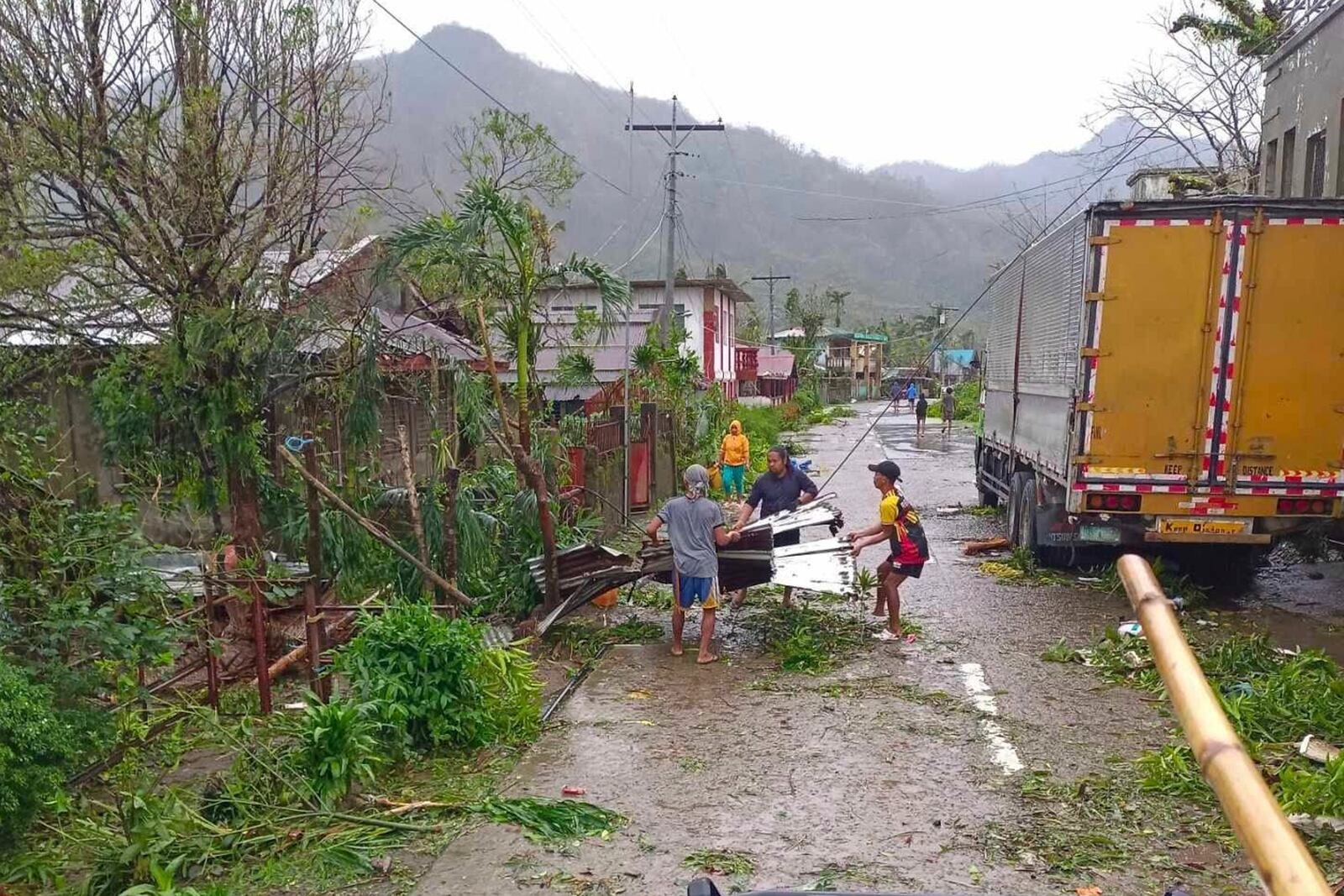 In this photo provided by the MDRRMO Viga Catanduanes, residents try to fix their damaged homes caused by Typhoon Man-yi in Viga, Catanduanes province, northeastern Philippines Sunday, Nov. 17, 2024. (MDRRMO Viga Catanduanes via AP)