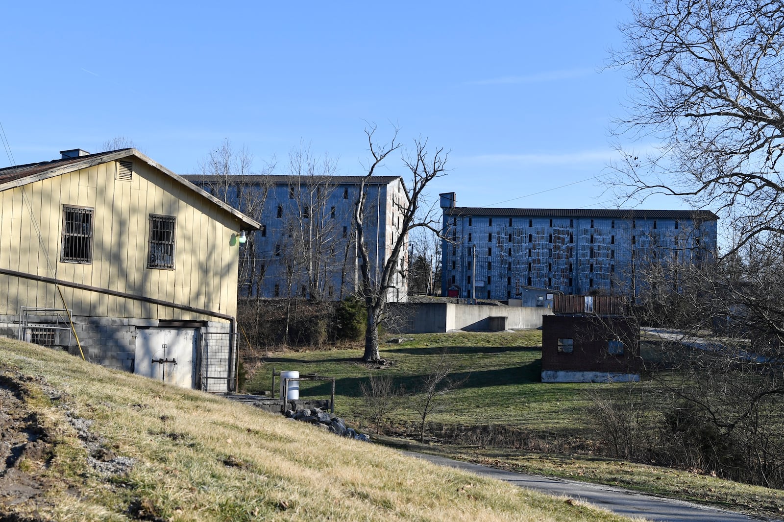 Bourbon barrel rack houses sit on a hillside at the Four Roses Distillery in Lawrenceburg, Ky., Monday, Feb. 3, 2025. (AP Photo/Timothy D. Easley)