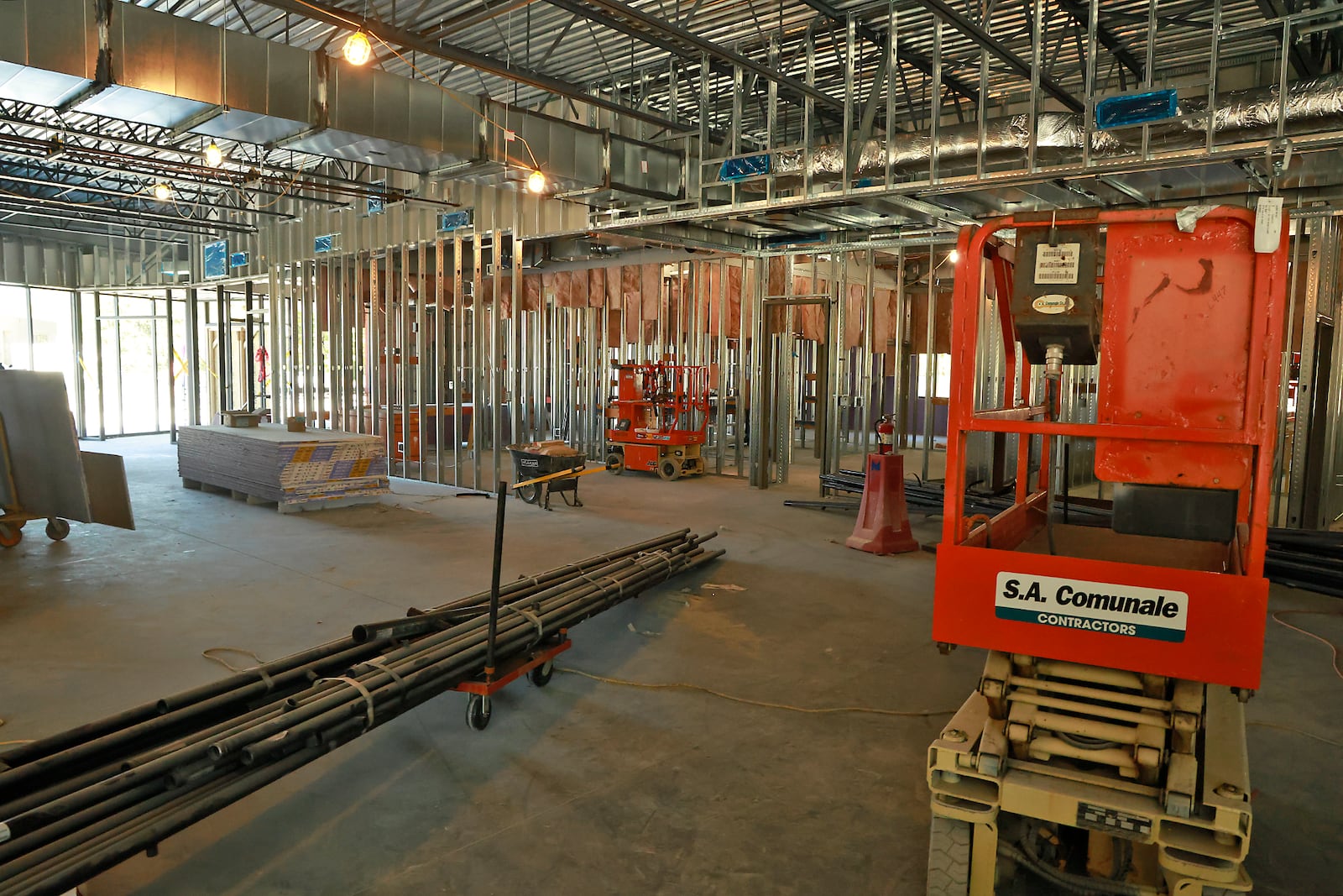 Members of the Global Impact STEM Academy Board of Directors took a tour of the school's new Upper Academy under construction on the Clark State College Leffel Lane campus Tuesday, Oct. 8, 2024. BILL LACKEY/STAFF