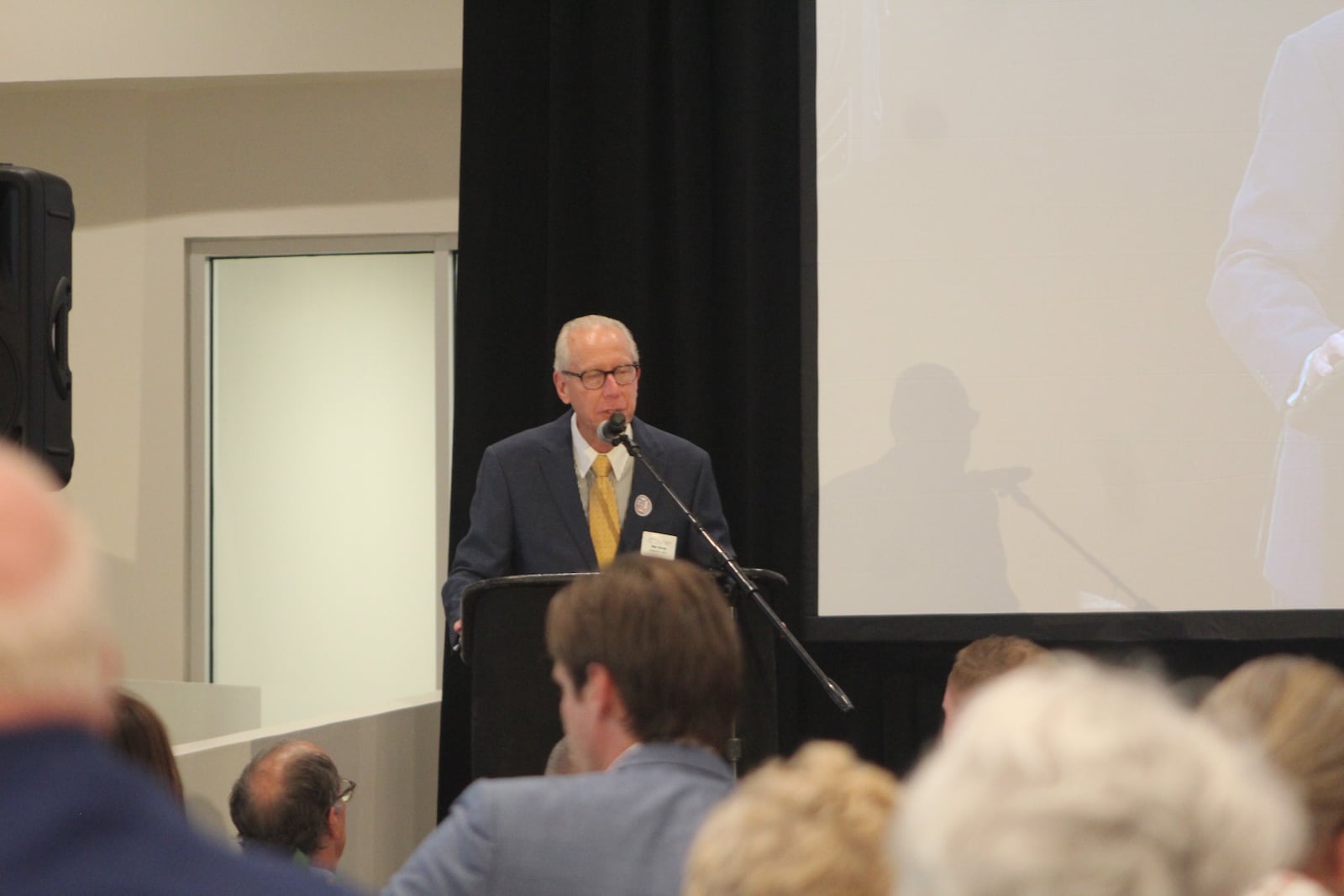 Wes Young, executive vice president of St. Mary Development Corp., speaks at a ribbon-cutting this week for the renovation of the Biltmore Towers. The building has 230 units of affordable housing for seniors. CORNELIUS FROLIK / STAFF