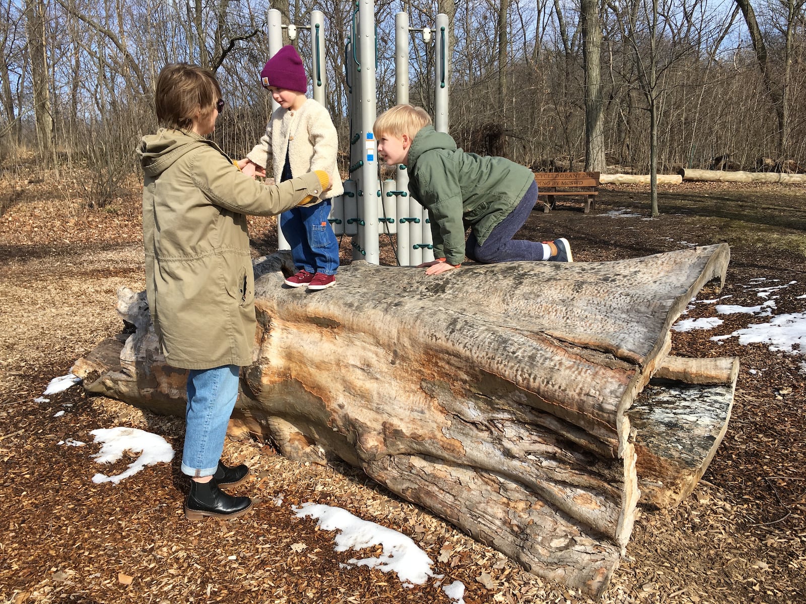 Kettering resident, Kasey Ohl, and her children Axel and Charlotte, play at the nature play area at Hills & Dales MetroPark . PHOTO CREDIT: Sarah Franks