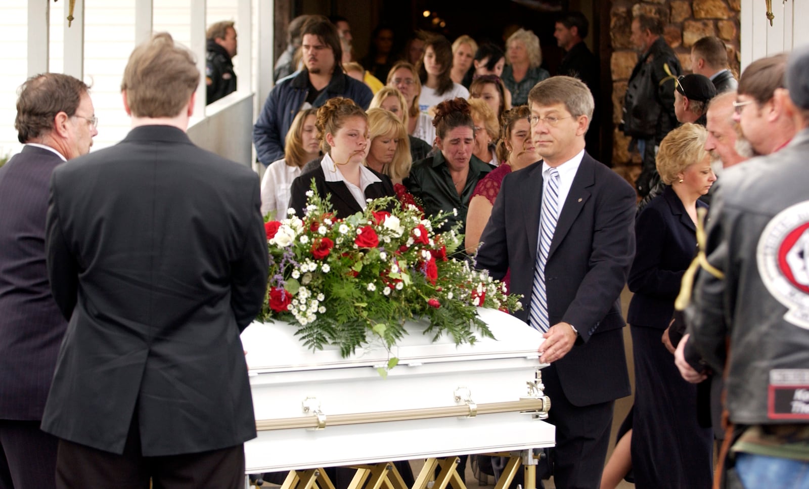 FILE - Pallbearers and employees of Clark Funeral Home get ready to put Rowan Ford's casket into a hearst after the funeral at the Gospel Lighthouse Church in Neosho, Mo., Nov. 14, 2007. (AP Photo/Mike Gullett, File)