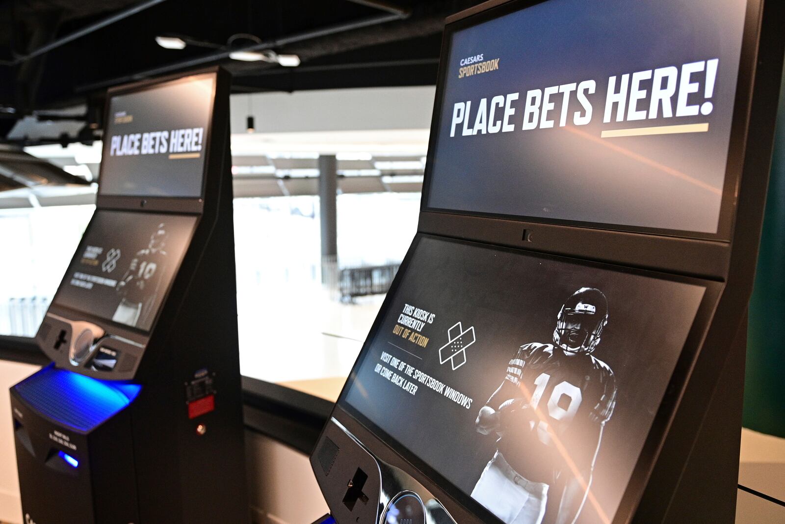 Betting kiosks are seen inside Caesars Sportsbook inside Rocket Mortgage FieldHouse, Thursday, Dec. 29, 2022, in Cleveland. With sports gambling becoming legal in Ohio on Jan. 1 at midnight, the Cleveland Cavaliers NBA basketball team is opening a stylish, two-story sports book, where fans can wager on games around the country — as well as the one they're attending. (AP Photo/David Dermer)