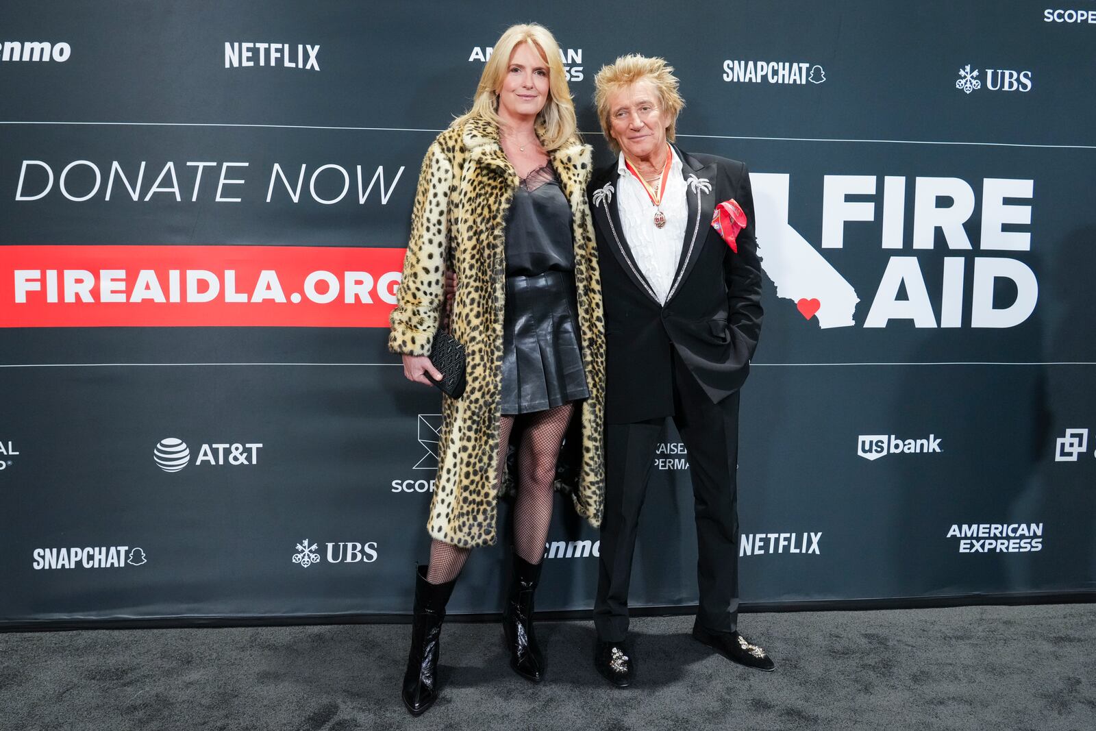 Penny Lancaster, left, and Rod Stewart arrive at the FireAid benefit concert on Thursday, Jan. 30, 2025, at Intuit Dome in Inglewood, Calif. (Photo by Jordan Strauss/Invision/AP)