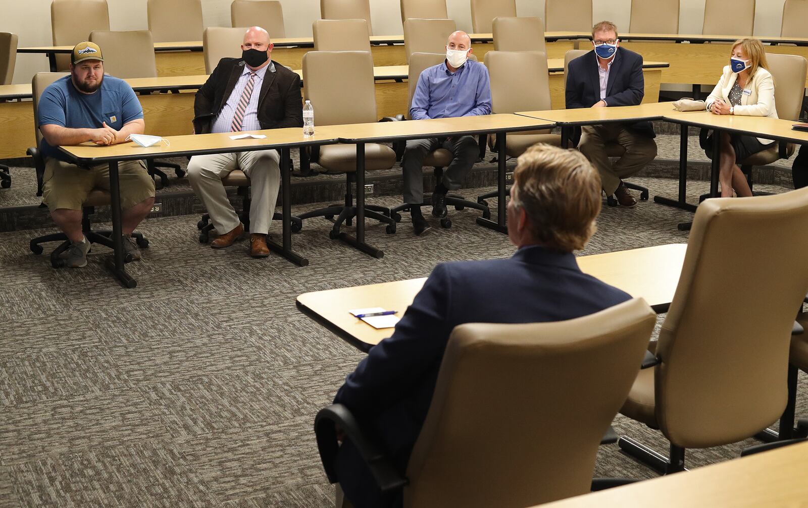 Ohio Lt. Governor Jon Husted has a roundtable discussion with local officials and small business owners at the Springfield Small Business Development Center Tuesday. BILL LACKEY/STAFF