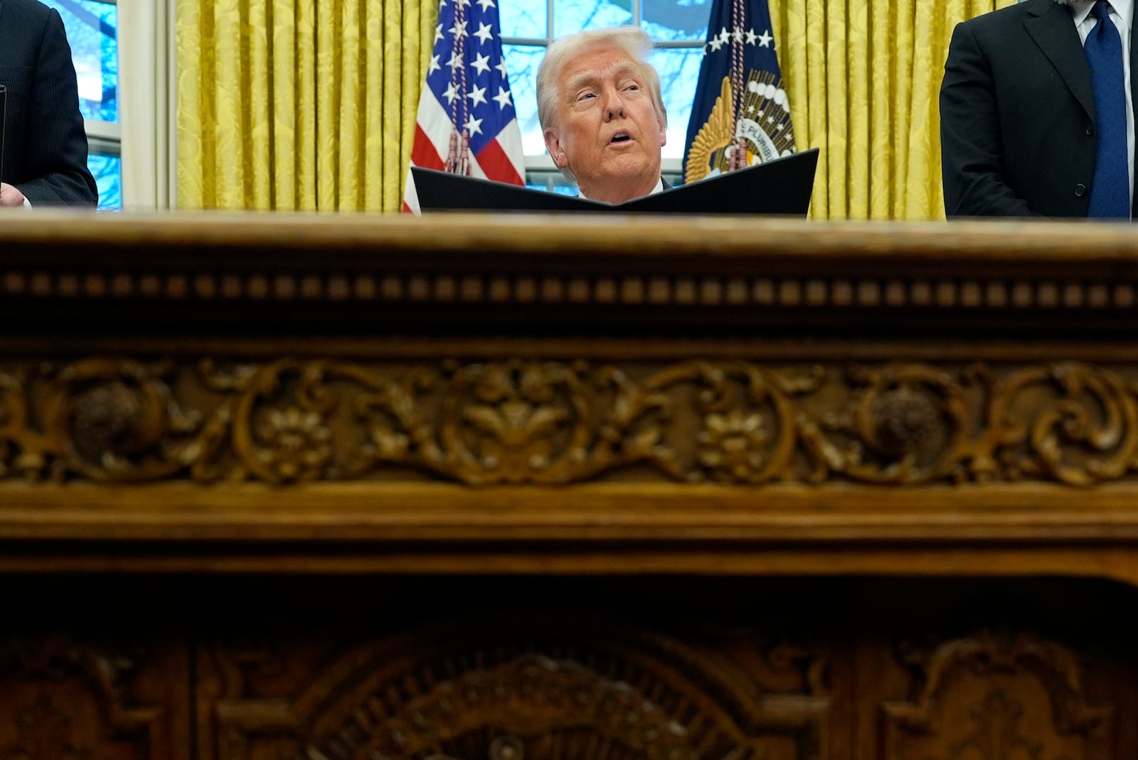 President Donald Trump speaks with reporters as he signs an executive order in the Oval Office at the White House, Monday, Feb. 10, 2025, in Washington. (Photo/Alex Brandon)