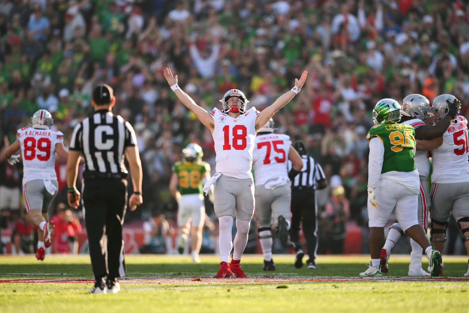 Ohio State quarterback Will Howard (18) celebrates his touchdown pass against Oregon during the first half in the quarterfinals of the Rose Bowl College Football Playoff, Wednesday, Jan. 1, 2025, in Pasadena, Calif. (AP Photo/Kyusung Gong)