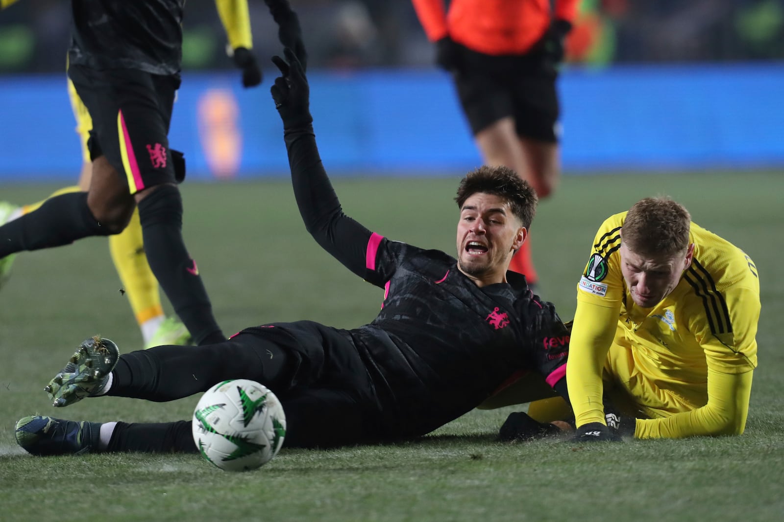 Chelsea's Marc Guiu, left, fights for the ball with Astana's Alexandr Marochkin during the Europa Conference League opening phase soccer match between Astana and Chelsea at the Almaty Ortalyk stadium in Almaty, Kazakhstan, Thursday, Dec. 12, 2024. (AP Photo)