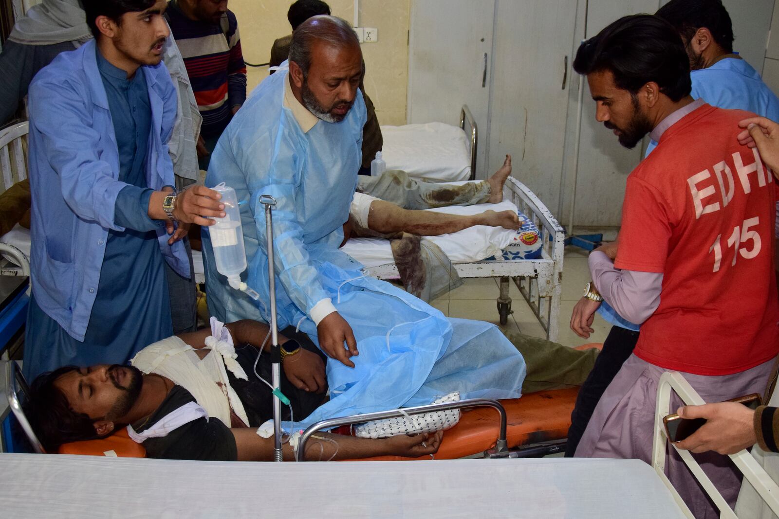 An injured victim of a passenger train attacked by insurgents, receives treatment upon arrival at a hospital in Quetta, Pakistan's southwestern Balochistan province, Thursday March 13, 2025. (AP Photo/Arshad Butt)