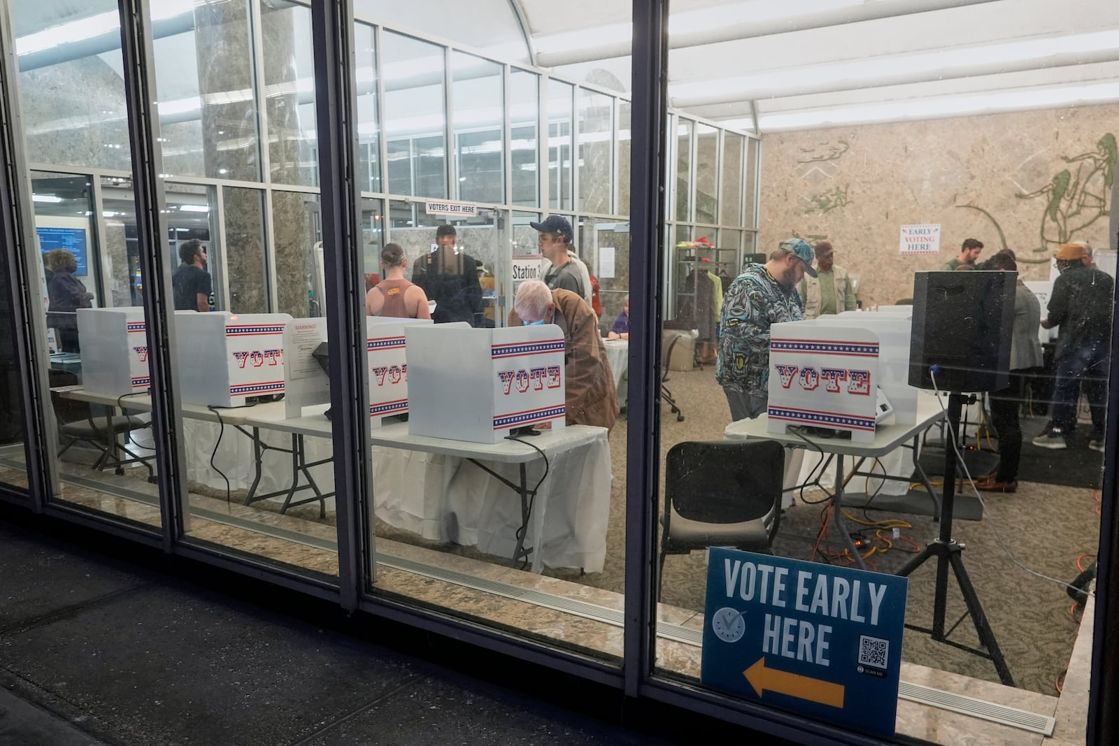 Voters cast their ballots at the Frank P. Zeidler Municipal Building during the first day of Wisconsin's in-person absentee voting Tuesday, Oct. 22, 2024, in Milwaukee. (AP Photo/Morry Gash)