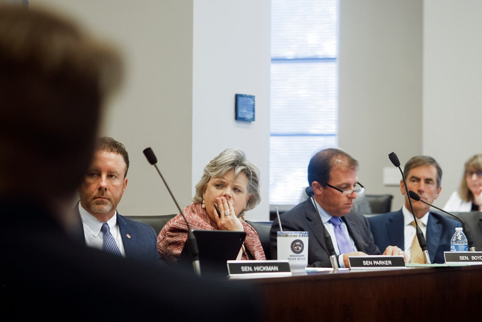 Republican Sens. David Parker of Olive Branch, Nicole Akins Boyd of Oxford, Josh Harkins of Flowood and Briggs Hopson of Vicksburg listen to a speaker during a meeting of the Mississippi Joint Legislative Budget Committee in the Woolfolk state office building Sept. 26, 2024, in Jackson, Miss. (AP Photo/Justin Hardiman)