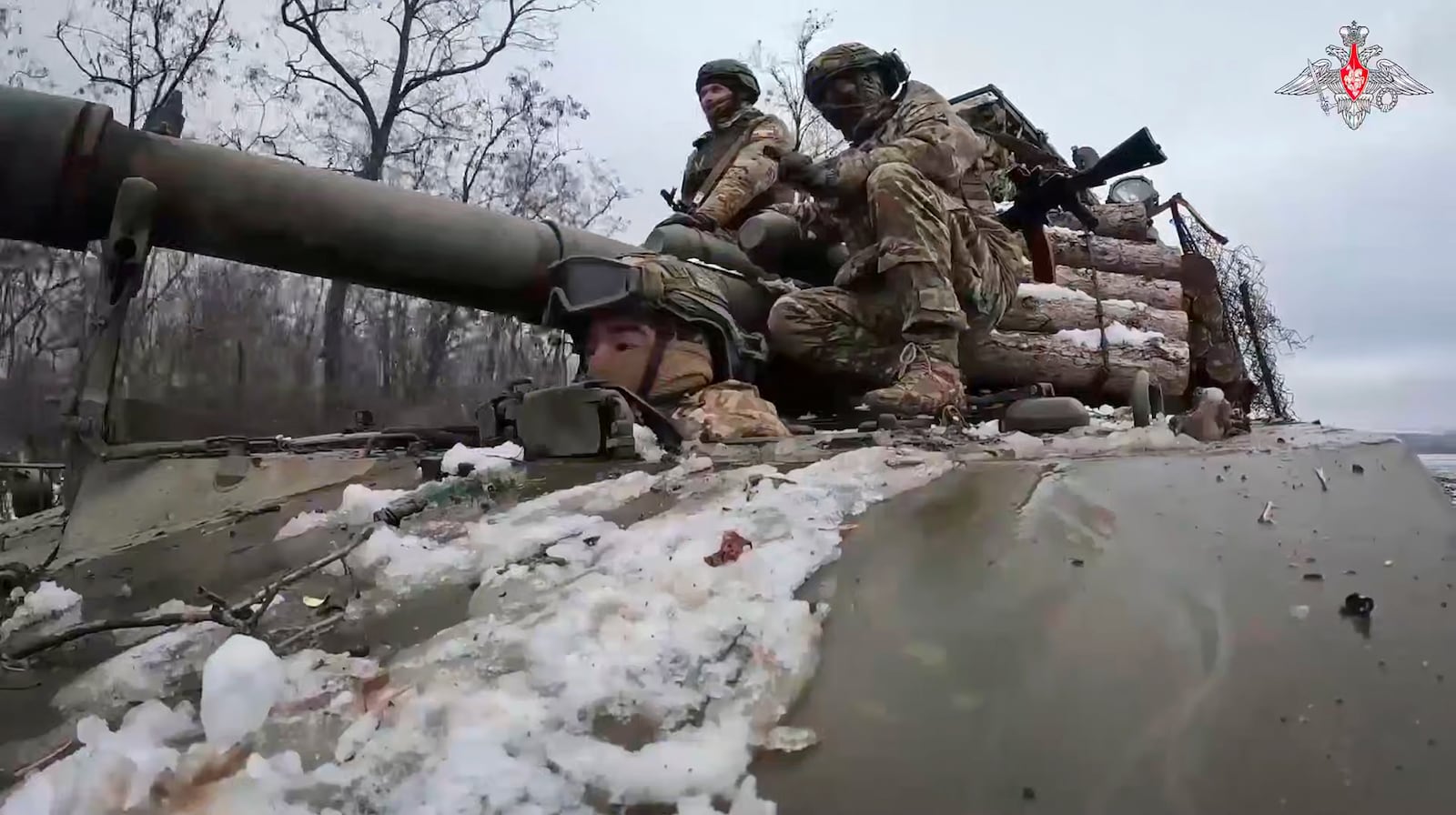 In this photo taken from video released by Russian Defense Ministry Press Service on Wednesday, Feb. 12, 2025, Russian soldiers ride atop Akatsyia self-propelled gun on an undisclosed location in eastern Ukraine. (Russian Defense Ministry Press Service via AP)