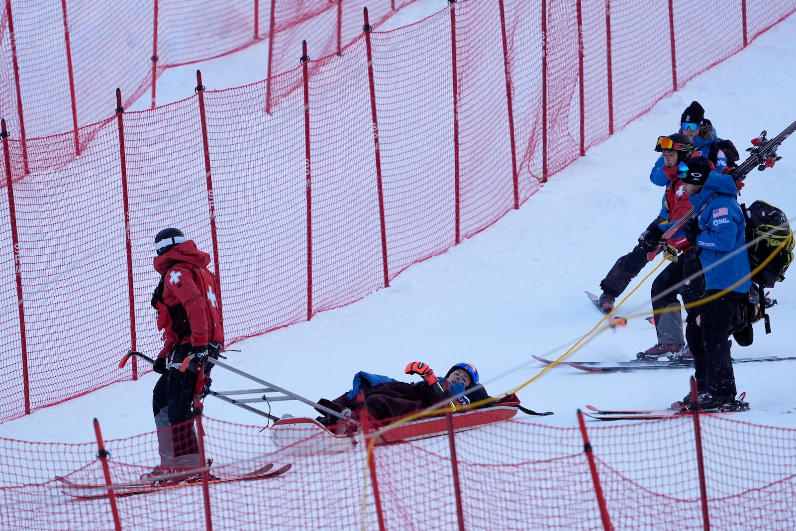 Mikaela Shiffrin, of the United States, is taken down the mountain on a sled by ski patrol after crashing during the second run of a women's World Cup giant slalom skiing race, Saturday, Nov. 30, 2024, in Killington, Vt. (AP Photo/Robert F. Bukaty)