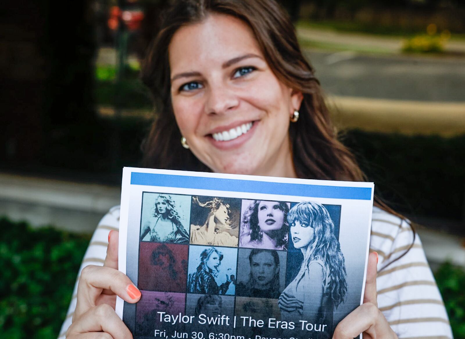 Kenzie McEvily, from Oakwood, shows her Taylor Swift ticket she purchased in November of last year. McEvily is going to the concert in Cincinnati with four friends who can't wait to hear the surprise song, friendship bracelets and outfits. JIM NOELKER/STAFF