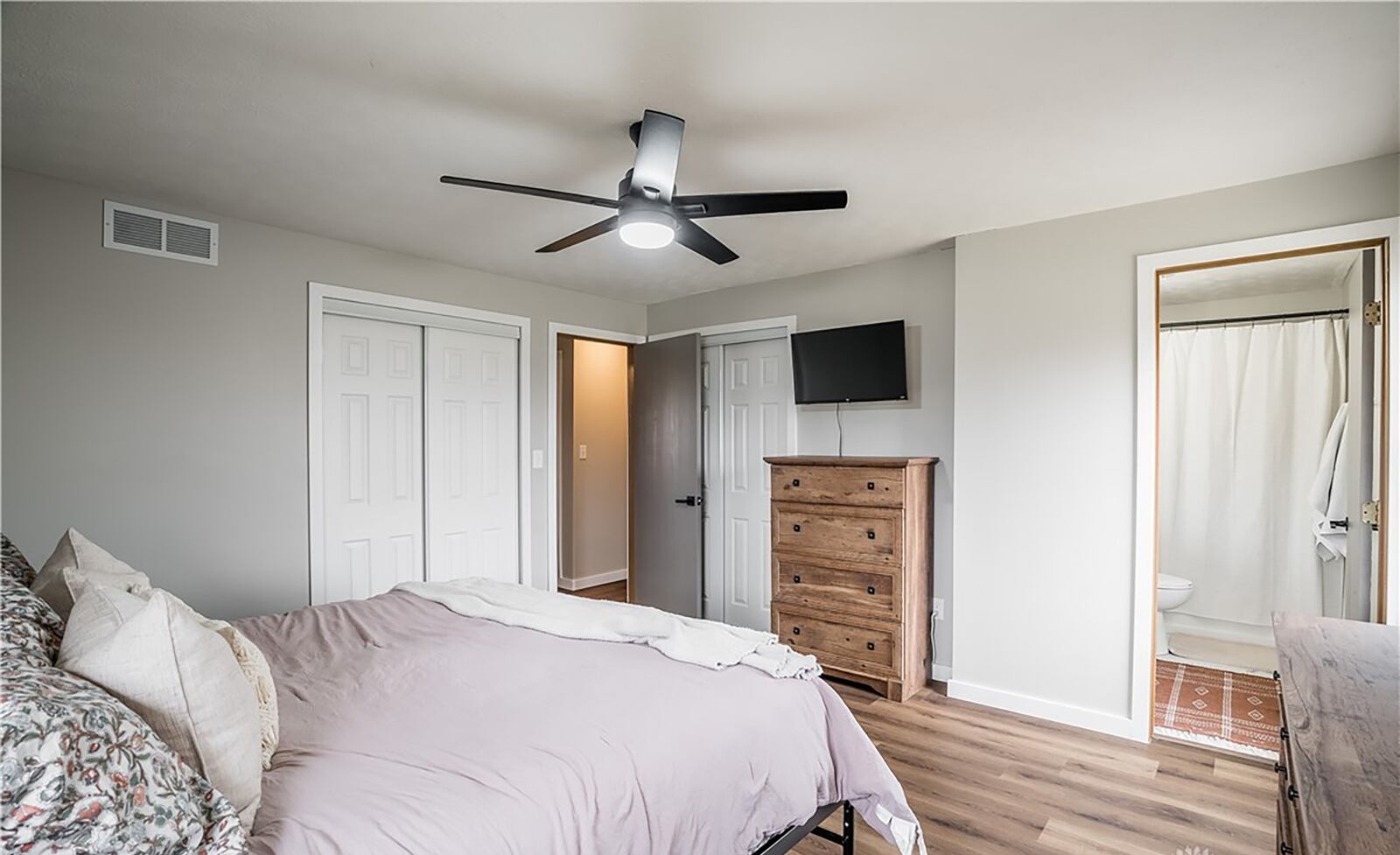 The primary bedroom suite has luxury vinyl tile flooring, two closets and an ensuite bathroom.