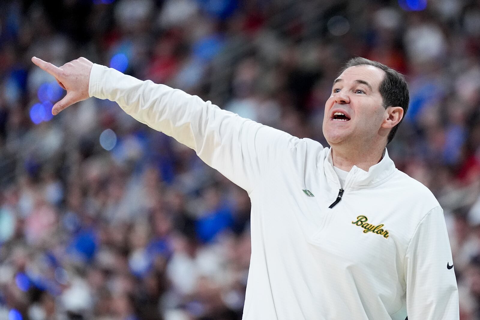 Baylor head coach Scott Drew yells during the first half against Duke in the second round of the NCAA college basketball tournament, Sunday, March 23, 2025, in Raleigh, N.C. (AP Photo/Chris Carlson)