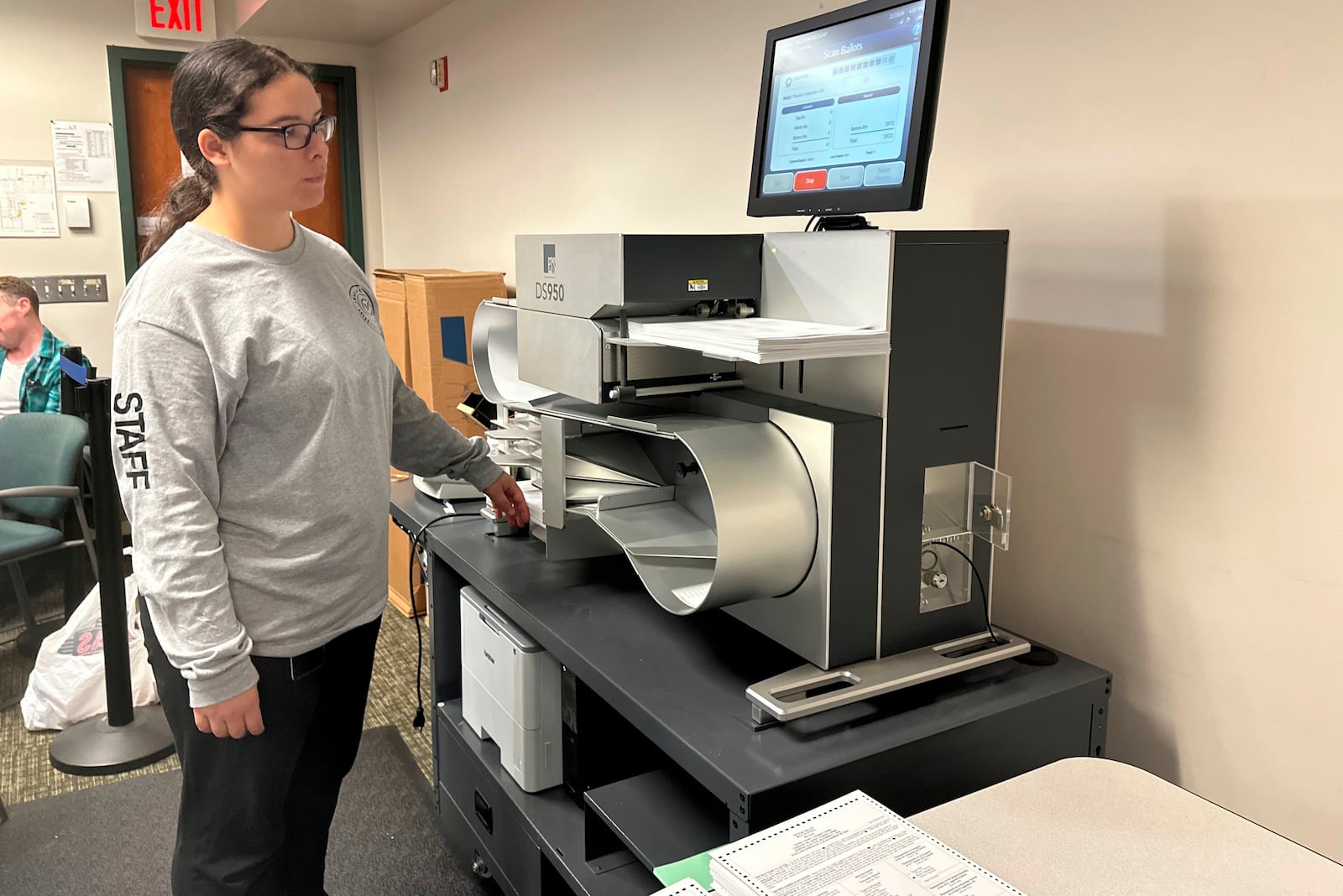 Ashley Medina of Lehigh County Voter Registration works with a tabulator in a state-mandated recount of the U.S. Senate race at the Lehigh County Government Center in Allentown, Pa., Tuesday, Nov. 19, 2024. (AP Photo/Michael Rubinkam)