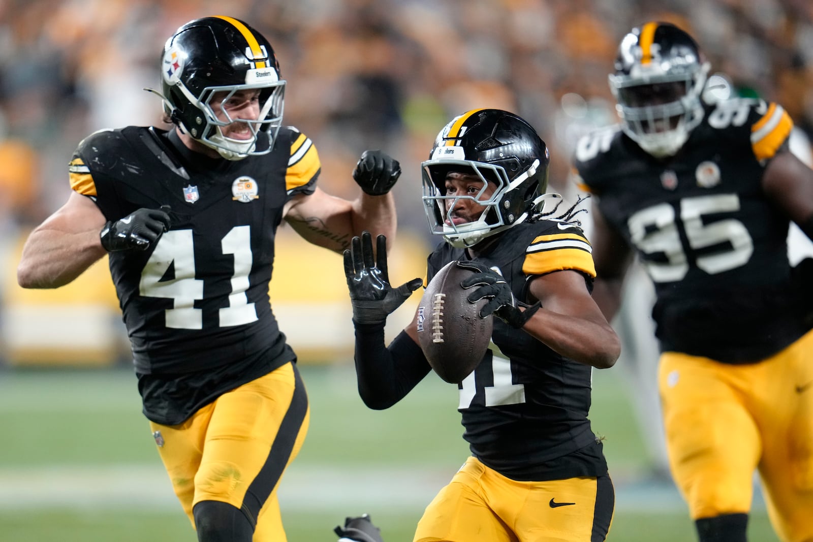 Pittsburgh Steelers cornerback Beanie Bishop Jr. (31) celebrates his interception with linebacker Payton Wilson (41) in the first half of an NFL football game against the New York Jets in Pittsburgh, Sunday, Oct. 20, 2024. (AP Photo/Gene J. Puskar)