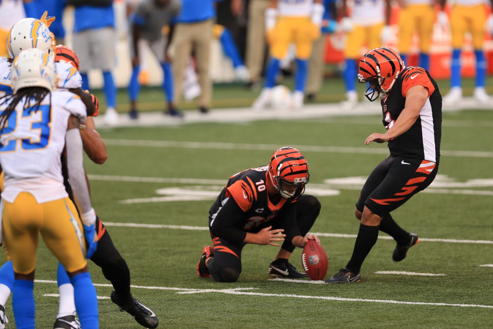 Cincinnati Bengals kicker Randy Bullock (4) misses a field goal out of the hold of Kevin Huber (10) during the second half of an NFL football game against the Los Angeles Chargers, Sunday, Sept. 13, 2020, in Cincinnati. The field goal would have tied the game. Los Angeles Chargers won 16-13. (AP Photo/Aaron Doster)