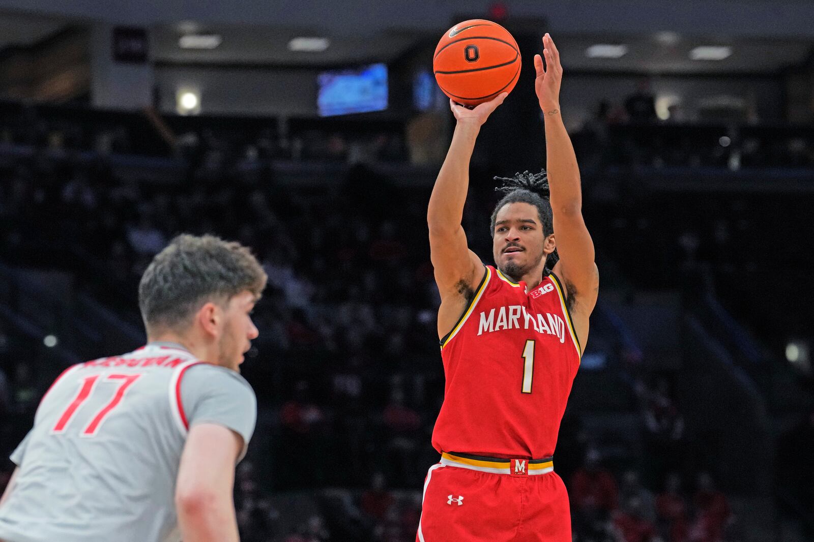 Maryland guard Rodney Rice (1) shoots over Ohio State center Ivan Njegovan (17) in the first half of an NCAA college basketball game Thursday, Feb. 6, 2025, in Columbus, Ohio. (AP Photo/Sue Ogrocki)