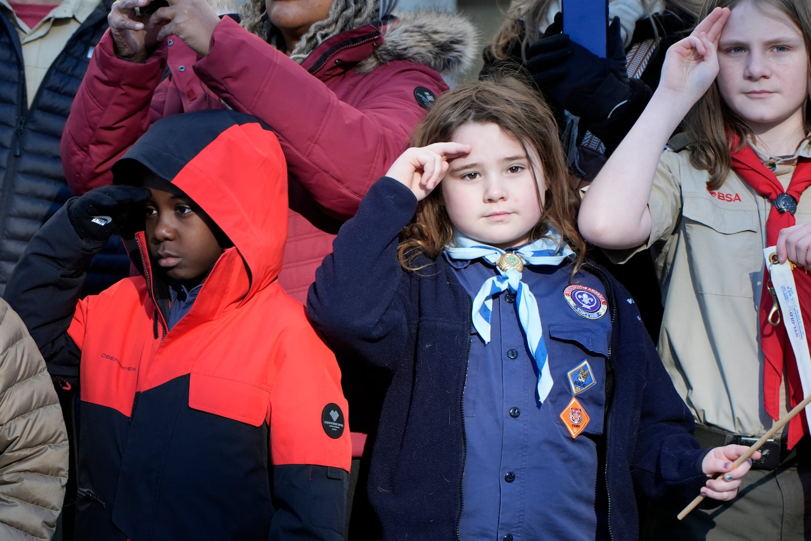 Children watch as the hearse carrying the flag-draped casket of former President Jimmy Carter pauses outside the State Capitol in Atlanta, Saturday, Jan. 4, 2025. Carter died Dec. 29 at the age of 100. (AP Photo/Alex Brandon, Pool)