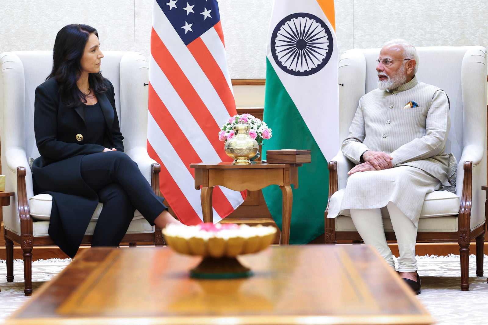 United States Director of National Intelligence Tulsi Gabbard, left, talks with Indian Prime Minister Narendra Modi during a meeting in New Delhi, India, Monday, March 17, 2025. (Government of India Press Information Bureau via AP)