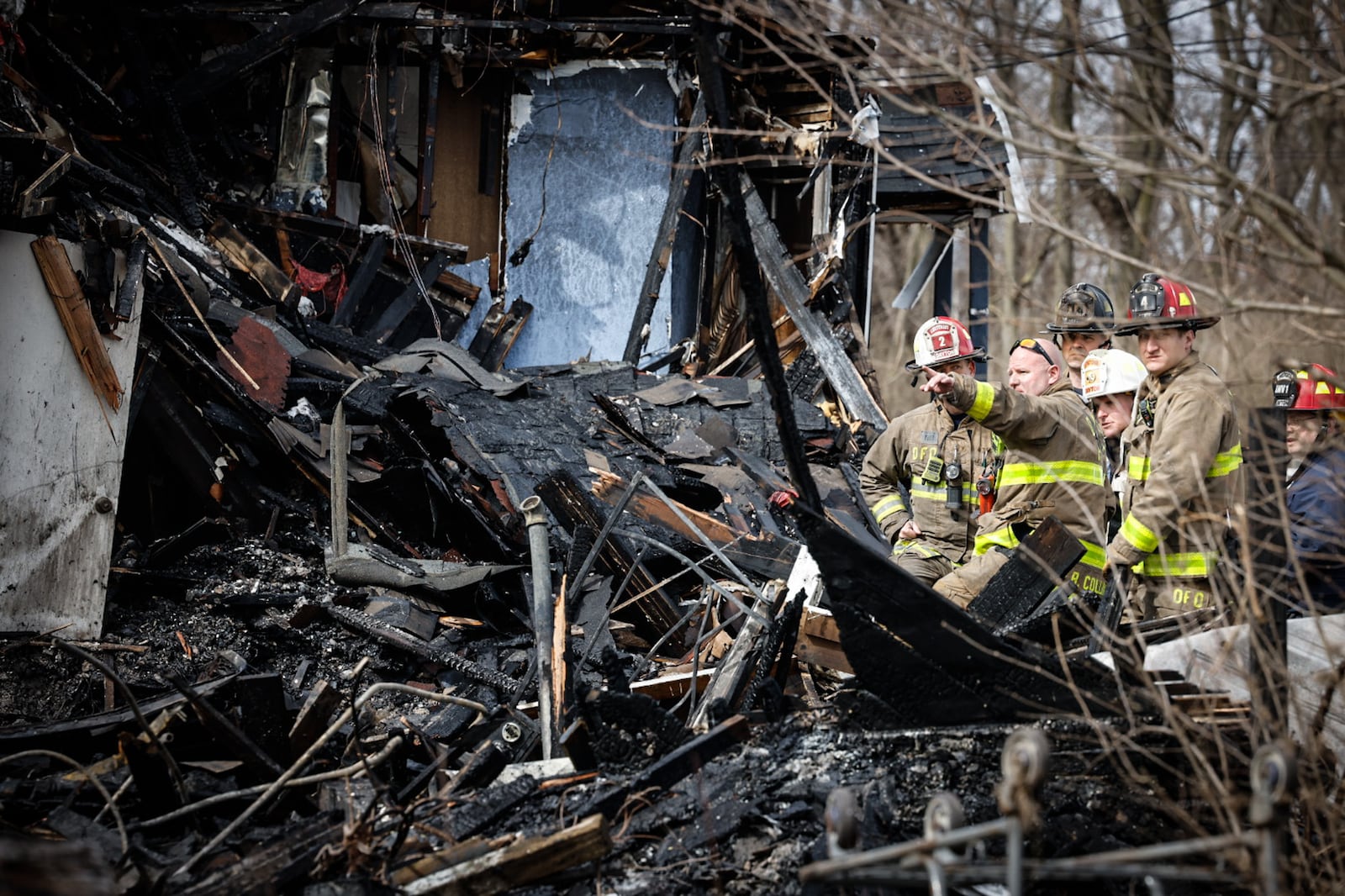 The bodies of five people were discovered in heavy debris in the aftermath of a large fire Wednesday morning, March 8, 2023, at a vacant house in the 500 block of North Broadway Street in Dayton. Crews ordered emergency demolition of two houses destroyed in the fire. A third house was damaged in the massive blaze. JIM NOELKER/STAFF