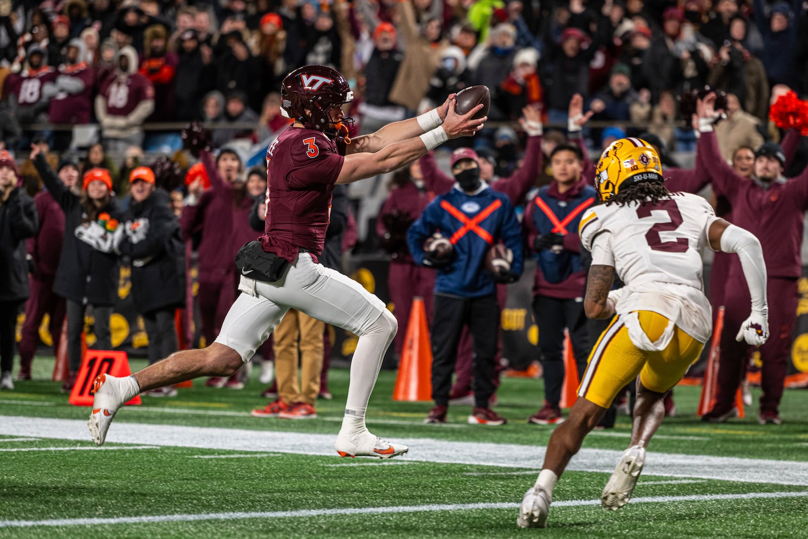 Virginia Tech quarterback Collin Schlee (3) goes in for a touchdown against Minnesota during the first half of the Duke's Mayo Bowl NCAA college football game Friday, Jan. 3, 2025, in Charlotte, N.C. (AP Photo/Robert Simmons)