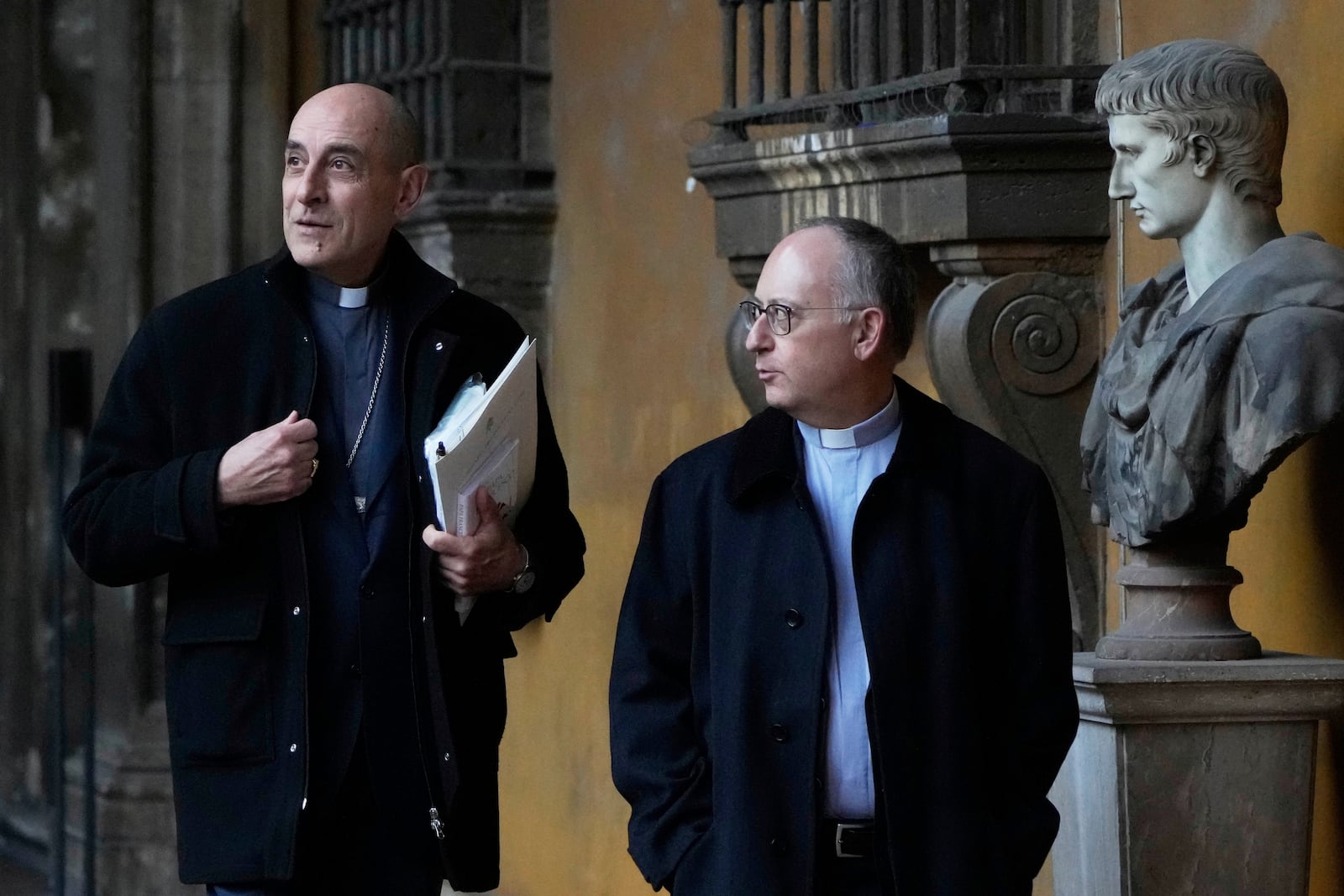 From left, Cardinal Victor Fernandez and Jesuit Father Antonio Spadaro arrive on the occasion of the presentation of a book by Pope Francis titled "Viva la Poesia" (long live poetry) in Rome, Friday, March 21, 2025. (AP Photo/Gregorio Borgia)