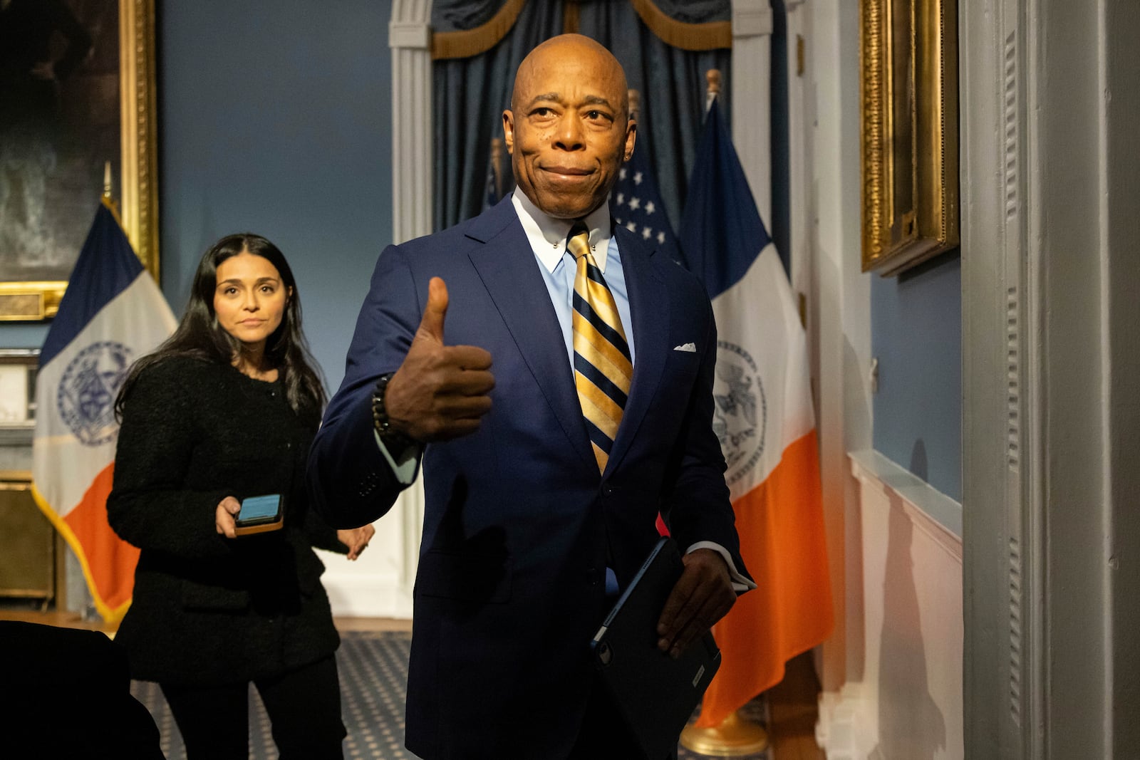 New York City Mayor Eric Adams gestures as he leaves a press conference at City Hall following meeting with President-elect Donald Trump’s incoming "border czar" Tom Homan, Thursday, Dec. 12, 2024, in New York. (AP Photo/Yuki Iwamura)