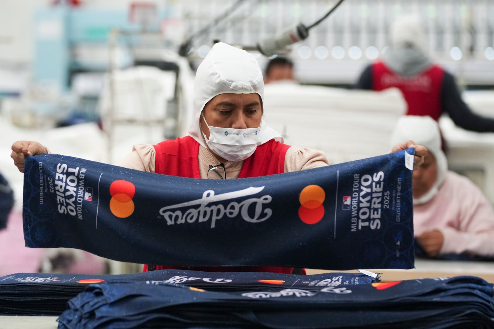 An employee works at a textile factory in Tlaxcala, Mexico, Tuesday, Feb. 4, 2025. (AP Photo/Eduardo Verdugo)