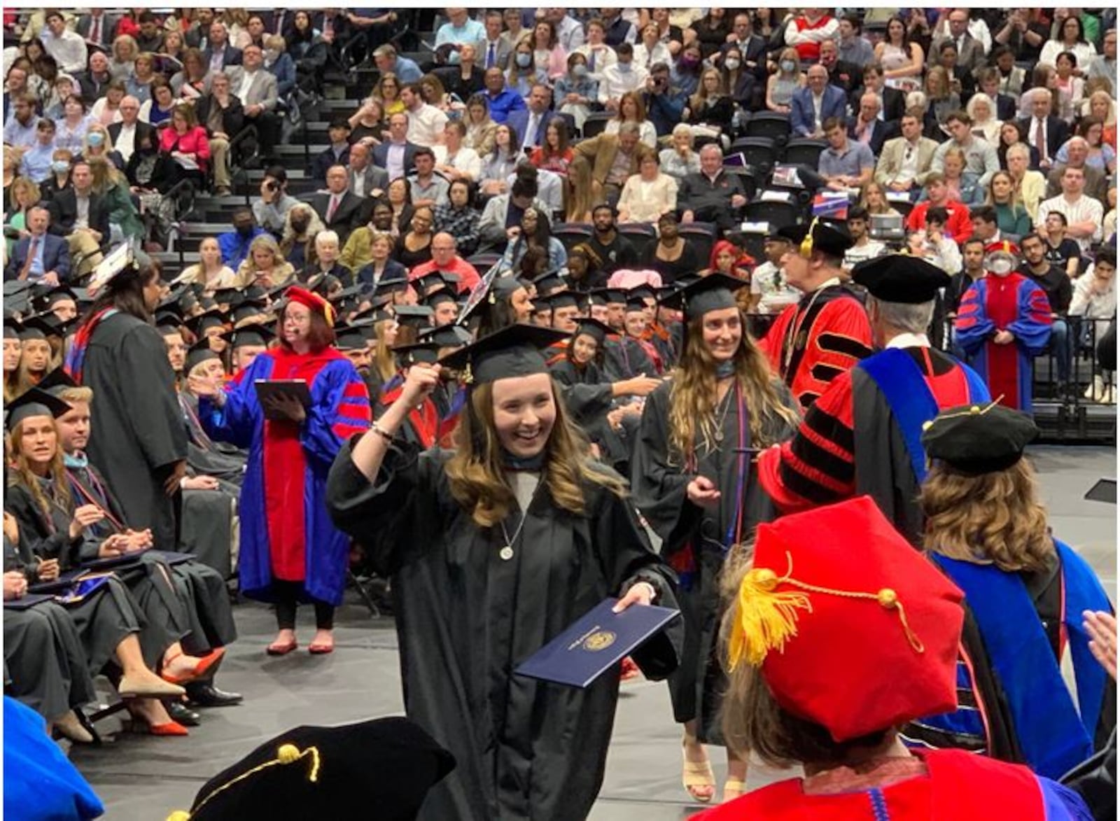 A new University of Dayton graduate is excited about receiving her college degree. UD held the first full spring graduation in three years.  ED RICHTER/STAFF