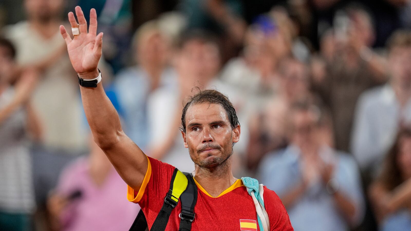 FILE - Rafael Nadal reacts waves after the men's doubles quarter-final tennis competition at the Roland Garros stadium, at the 2024 Summer Olympics, July 31, 2024, in Paris, France. (AP Photo/Manu Fernandez, file)