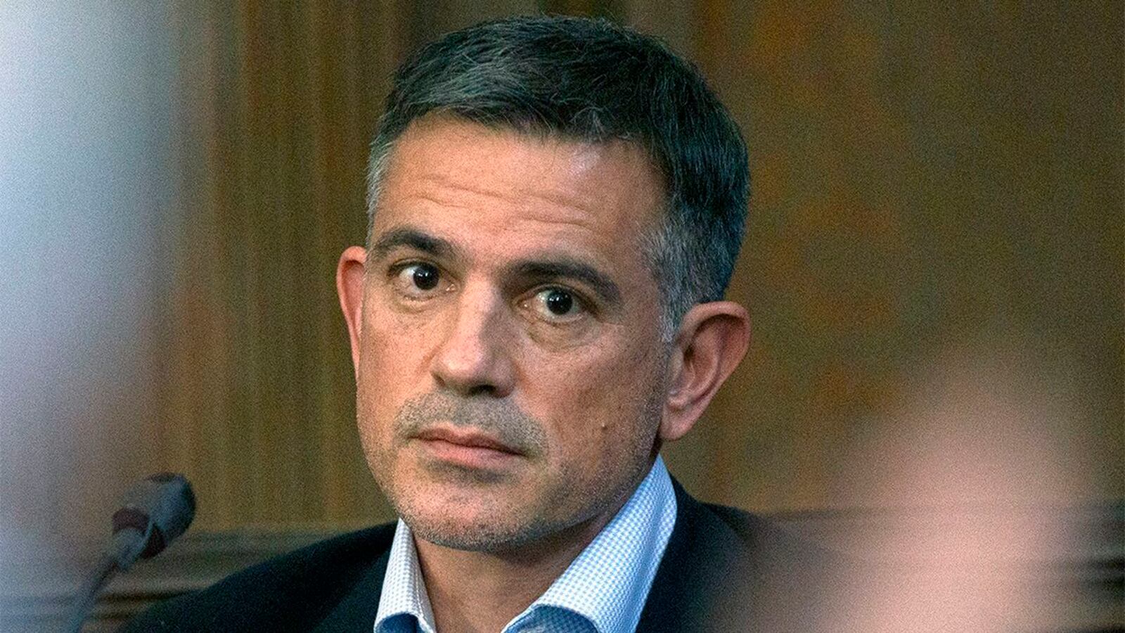 In this Dec. 4, 2019, photo, Fotis Dulos testifies in a civil case brought by his mother-in-law, Gloria Farber. Dulos, 52, of Farmington, Conn., is charged with murder in the May 2019 disappearance of his estranged wife, Jennifer Dulos. Fotis Dulos attempted suicide at his home Tuesday, Jan. 28, 2020.