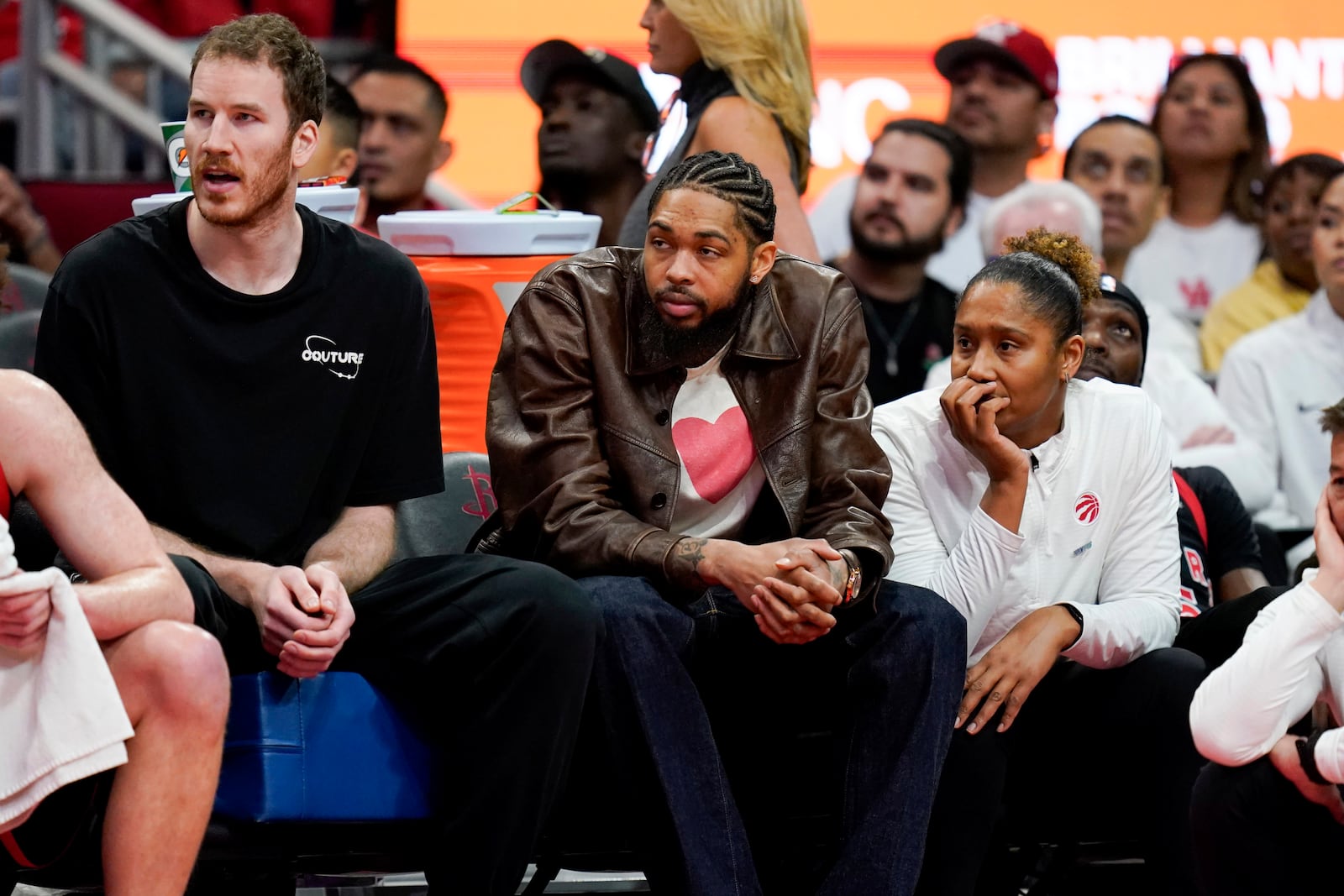 Toronto Raptors forward Brandon Ingram, center, watches from the bench during the second half of an NBA basketball game against the Houston Rockets, Sunday, Feb. 9, 2025, in Houston. (AP Photo/Eric Christian Smith)