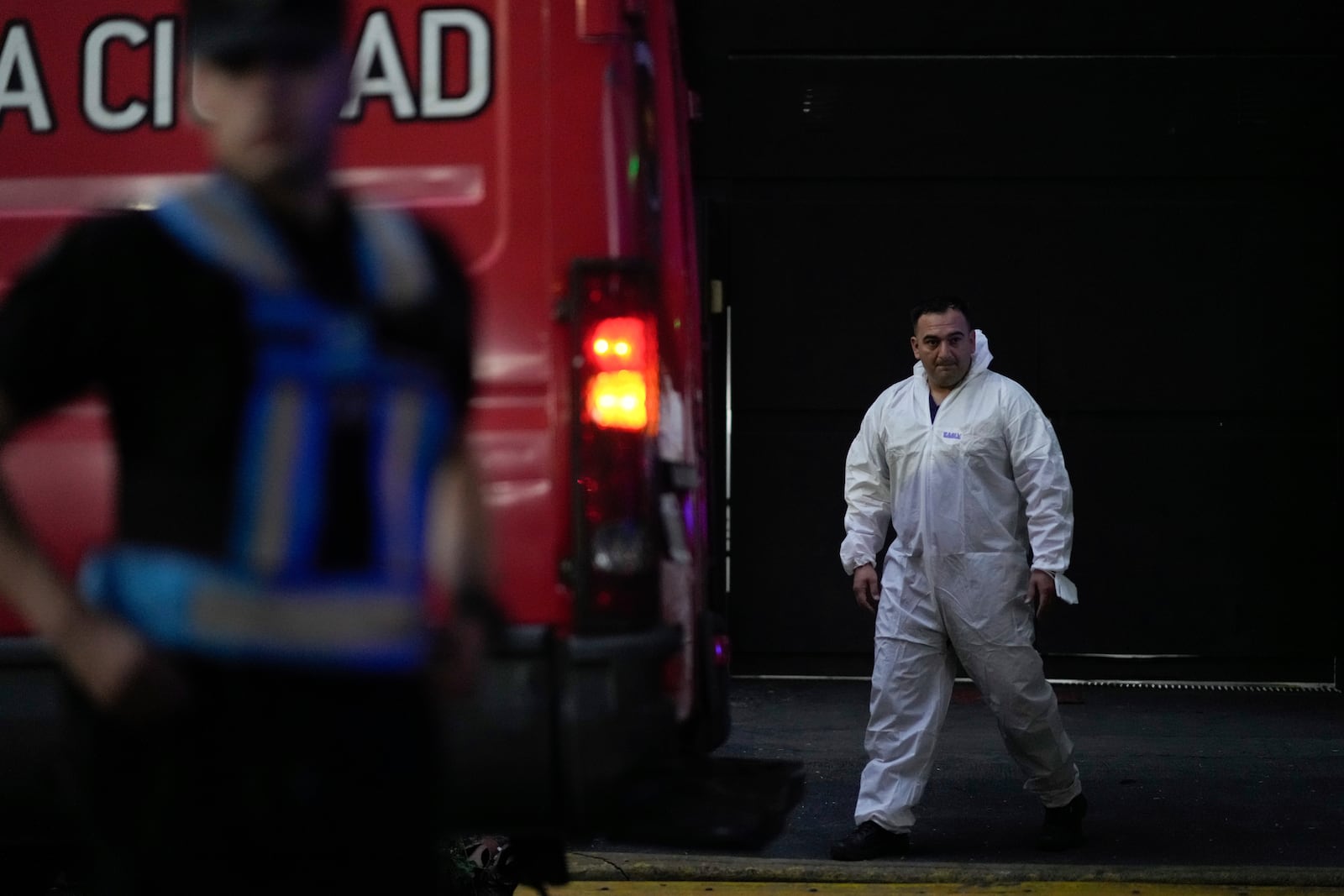 A forensic investigator exits the hotel where English musician Liam Payne, a former member of the band One Direction, was found dead after falling from a balcony in Buenos Aires, Argentina, Wednesday, Oct. 16, 2024. (AP Photo/Natacha Pisarenko)